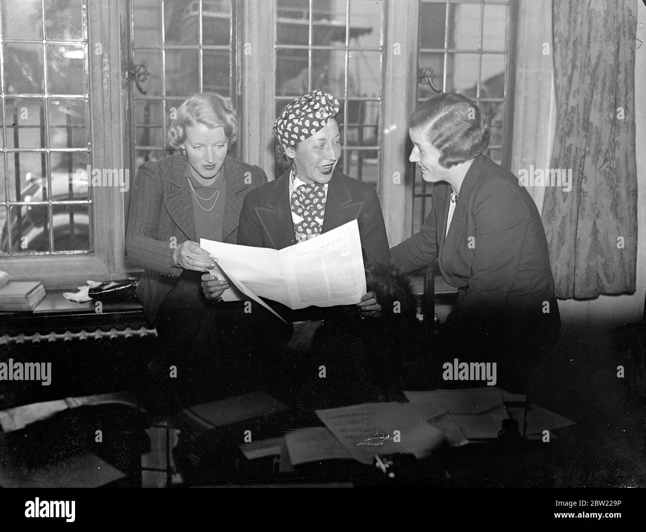 Women engineers discuss problems of aviation at their conference in London. Two highly technical problems to which the whole aircraft industry is applying itself, the formation of ice on aircraft in flight and the selection and treatment for steels for aero engines, are being dealt with in papers by Miss Dorothy Spicer and Miss Pauline Gower at the 15th annual conference of women's engineering which is open to Crosby Hall, Cheyne walk, Chelsea. President of the conference is Miss Amy Johnson ( Mrs Mollison), the air woman. Mrs Spicer, who holds the A and B, C and D ground engineers license wil Stock Photo