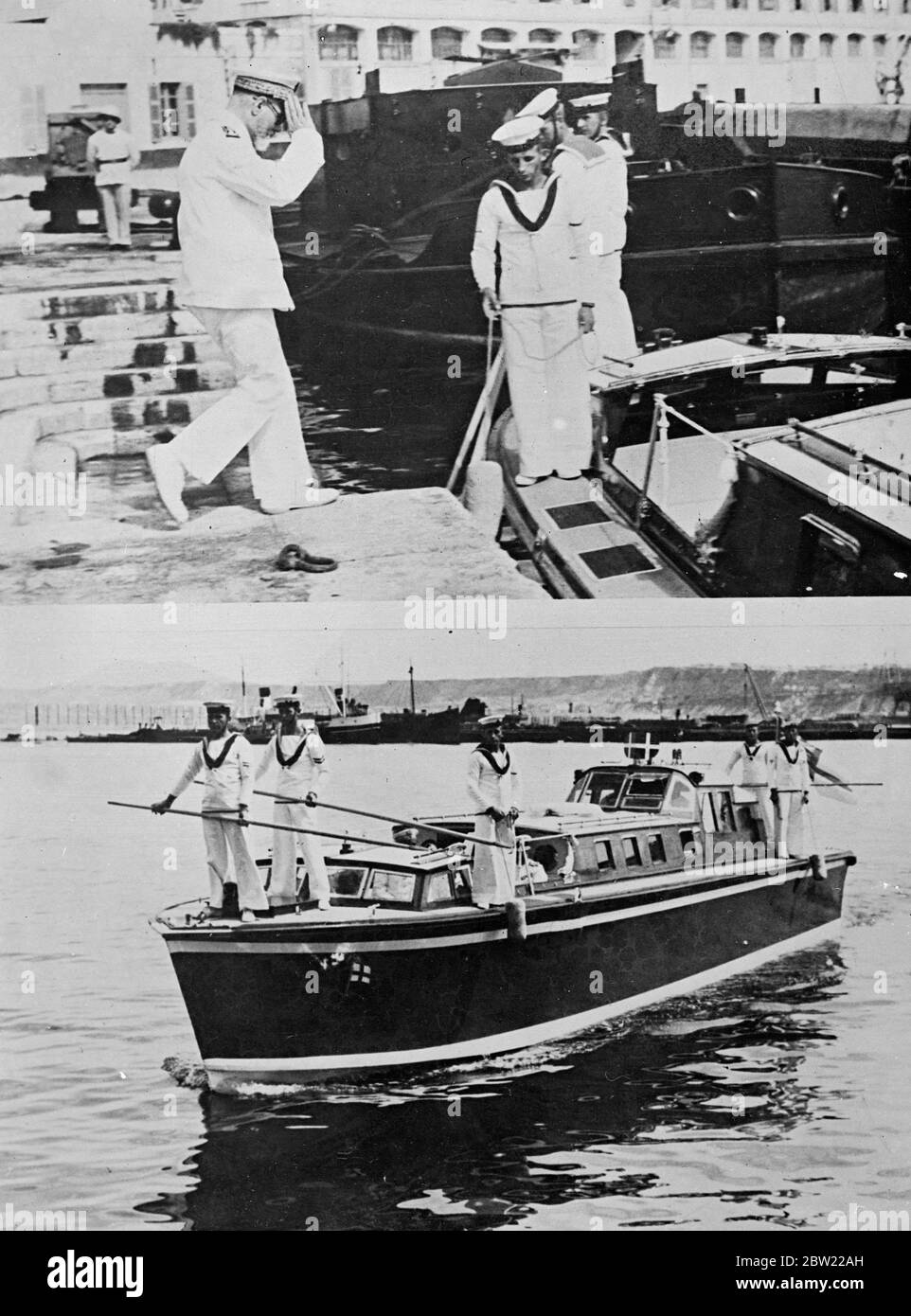 Admiral Sir Dudley Pound, Commander-in-Chief of the British Mediterranean Fleet, discussed with Vice Admiral Estevan of France anti piracy duties in the Mediterranean with the Admirals met aboard HMS Barham at Oran, Algeria. Admiral Esteban saluting as he went aboard the pinnace which took him out to HMS Barham at Oran. 21 September 1937. Stock Photo