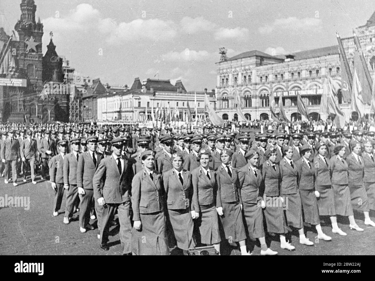 Young pupils of a flying school, interim uniforms marching through red Square, Moscow these young men and women are learning to fly in their spare time. Young athletes drawn from all sports society's in all parts of the Soviet Union paraded before Stalin and his chief ministers on the 23rd international youth Day in Moscow. 19 September 1937. Stock Photo