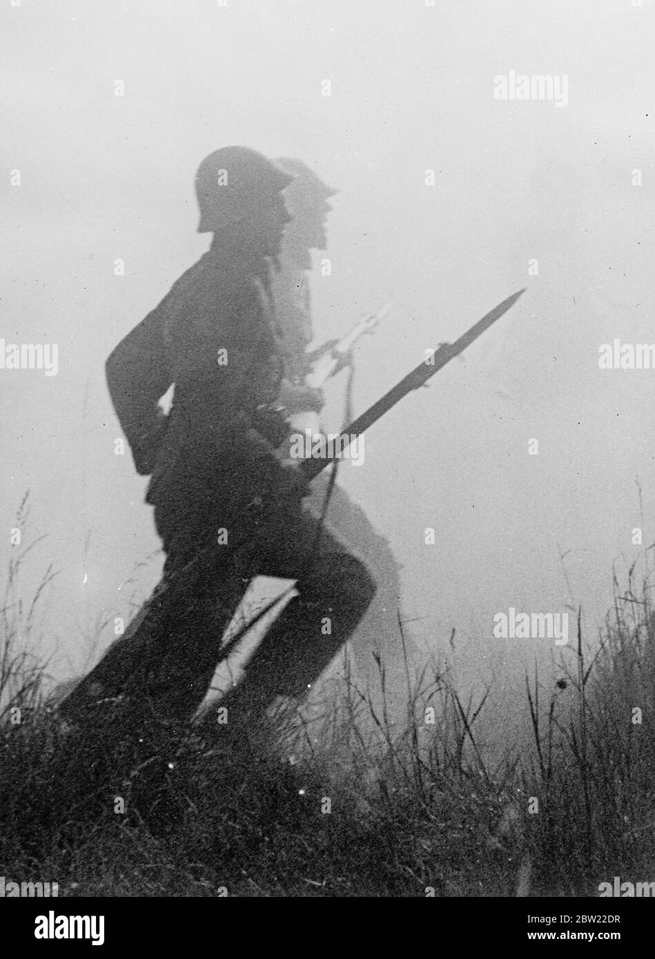 Ghostly shadow in steel helmets with bayonets fixed, men of the sea lifeguards planned tourists may crowd during realistic exercises near Stockholm. 7 September 1937. Stock Photo