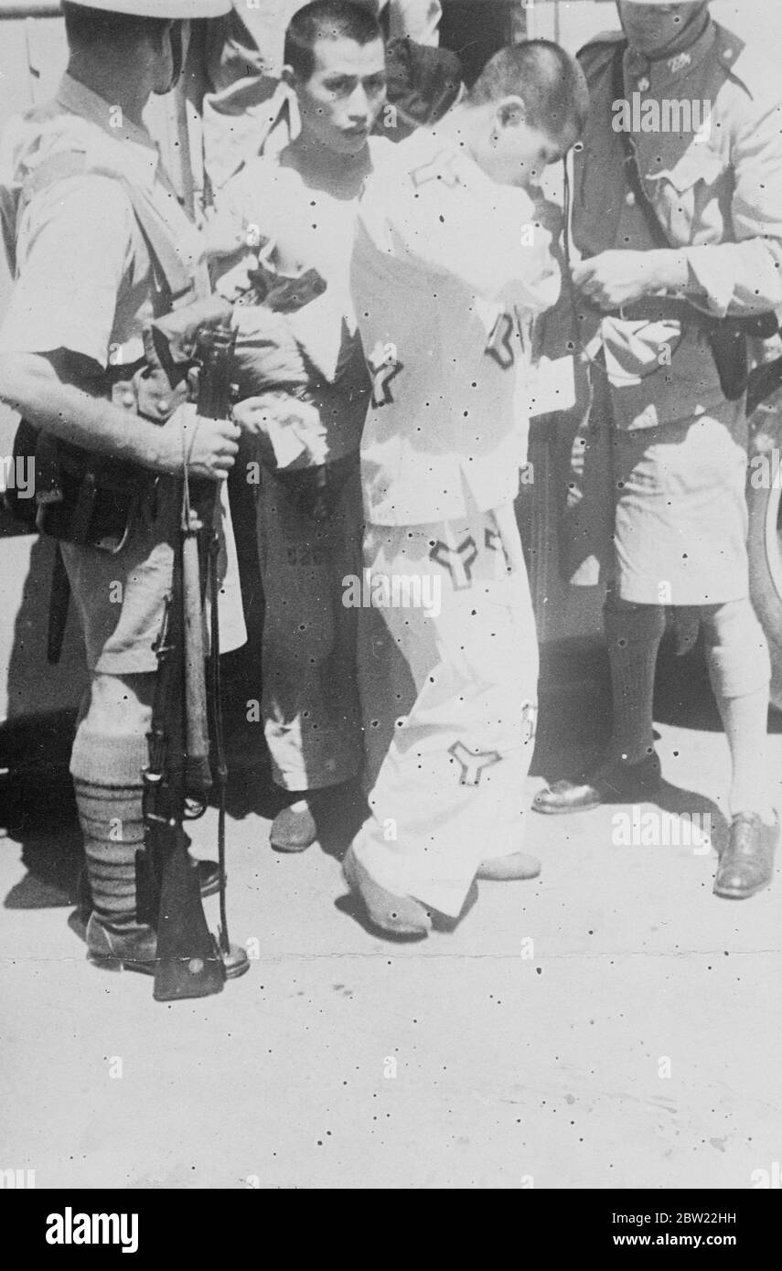 Hundred convicts, many Chinese were released when the Ward road Gaol Shanghai, the largest prison in the world, had to be evacuated during the Sino-Japanese fighting. The prison was hit several times by shells. 8 September 1937 [?] Stock Photo