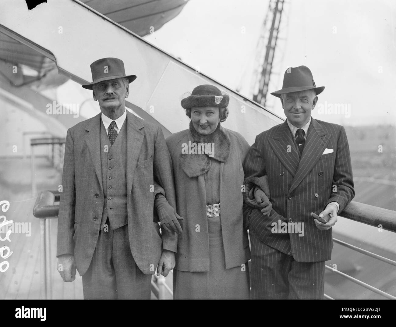 Mr, T.O.M Sopwith arrived at Southampton with his wife on the Queen Mary from America, where he challenged unsuccessfully with endeavour II for the America's Cup. 13 September 1937. Stock Photo