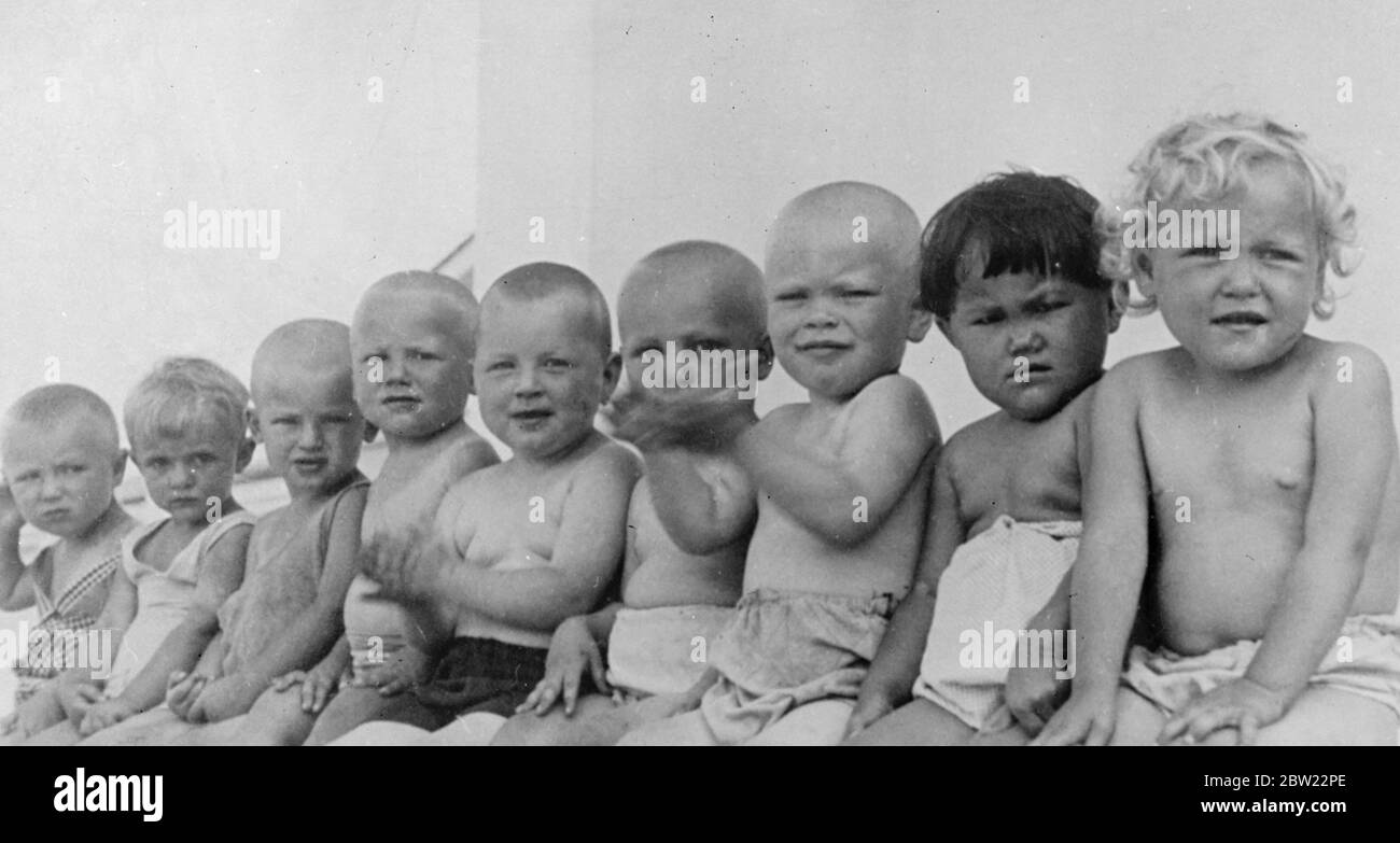 Nine of the Soviets funniest children hold their own baby show in the city of Komsomolak where they were born. Child welfare is receiving increasing attention in the Soviet Union and centres have been established for mothers and babies in many cities and towns. 7 September 1937. Stock Photo