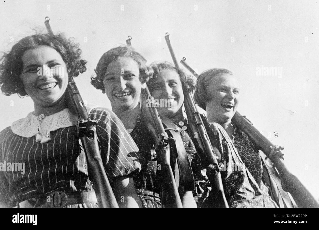 Young girls members of the pioneers (young communists) organisation in USSR now have lessons in sniping. Premier award in the school of marksmanship in the Voroshilov Sharpshooter badge named after the Commissioner for defence. 9 October 1937. Stock Photo