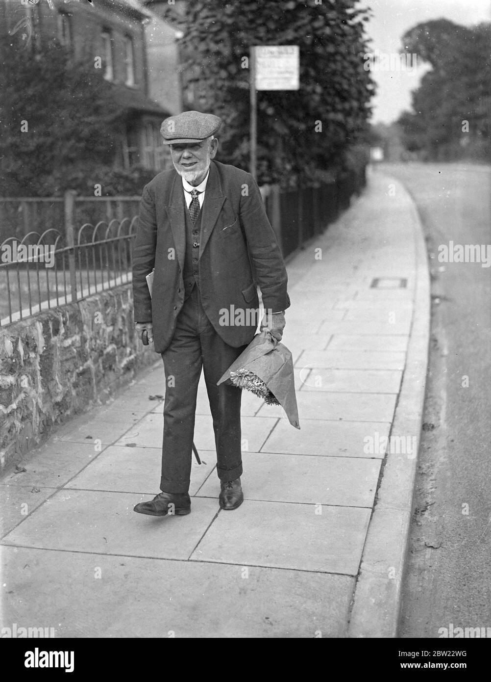 Mr. A.J Franklin who will be the first Mayor of the Newborough leaving his Bexley home with a bouquet of flowers grown in his garden. The 77-year-old market gardener who was born in the parish church bells will be the first Mayor when the town becomes a bar at the end of this month. 15 September 1937. Stock Photo