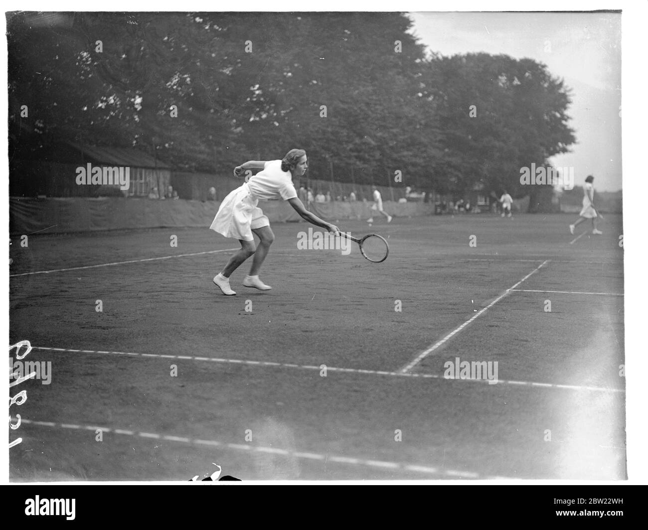The Middlesex Junior Tennis Championships opened at the Herga Club, Harrow, London. Miss Zinovieff in play. 30 August 1937 Stock Photo
