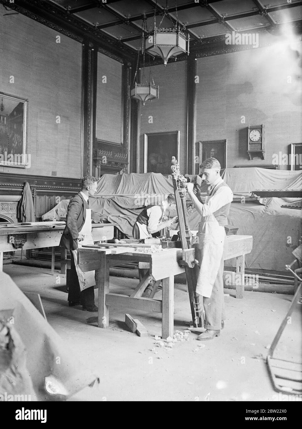 Workmen busy on the Cold Drinks Bar at the house of commons. The dignified ministers dining room at the House of Commons turned into a Carpenters workshop while it is converted into new members making. Alterations which members voted Â£7500 before starting their three-month holiday. One innovation that will probably prove popular is the cold drinks bar, which will very likely serve as cocktail bar. 14 September 1937. Stock Photo