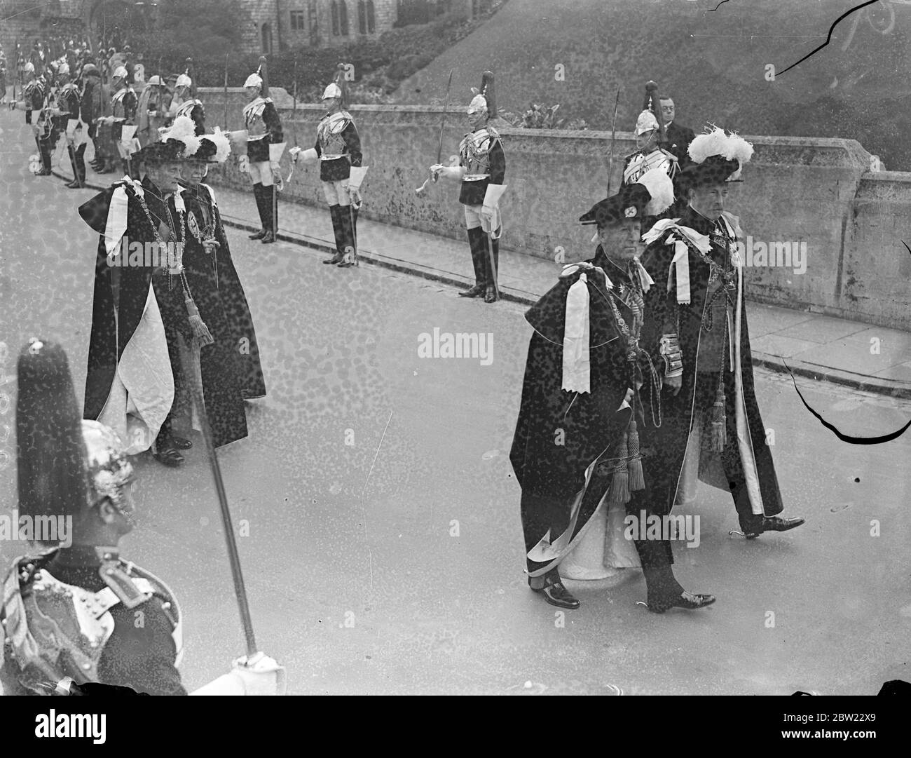 The Marquess of Londonderry (left) and the Earl of Harwood, in the procession, wearing robes during the order of the Garter ceremony at Windsor. 14 June 1937 ?] Stock Photo