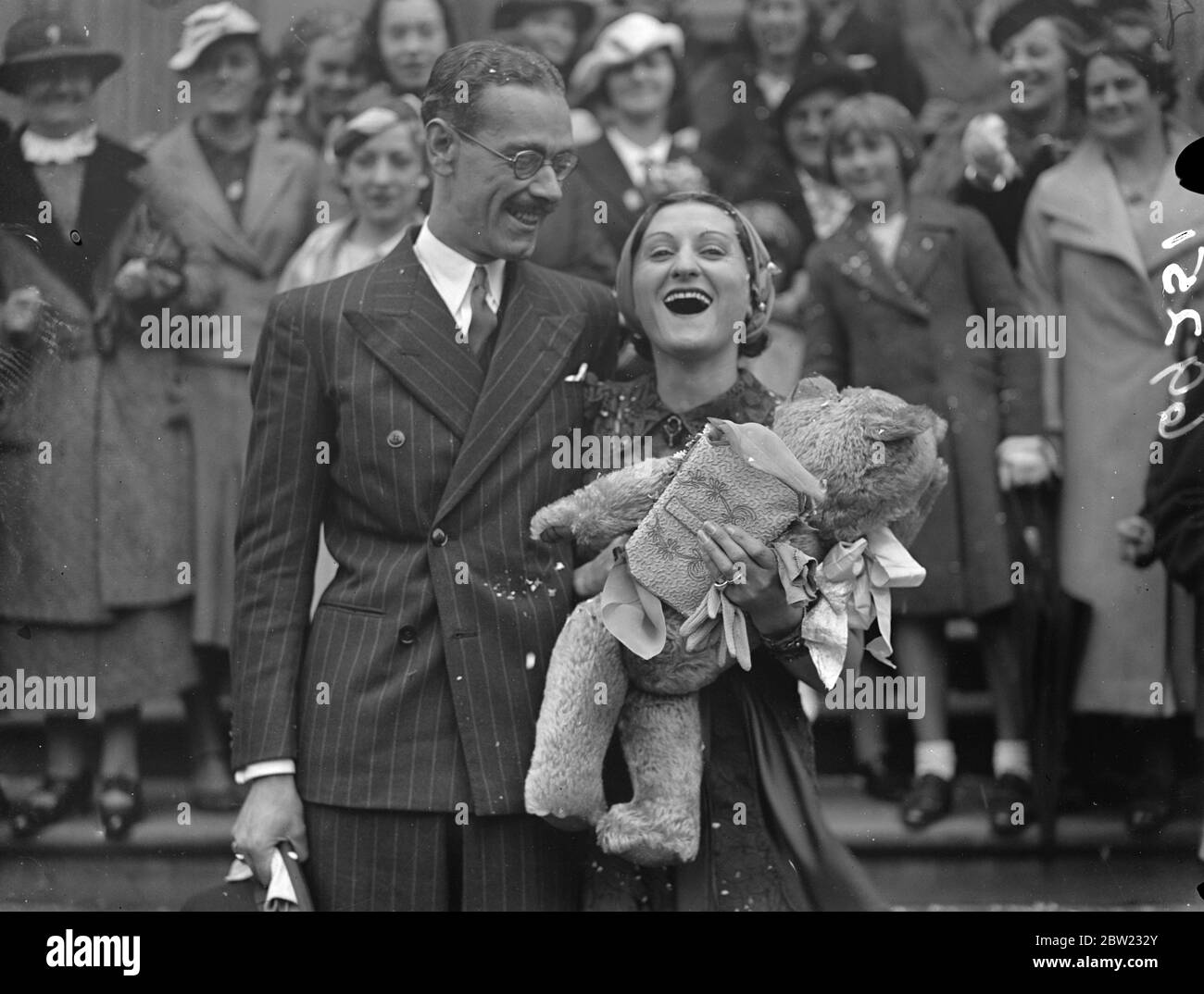 Miss Sali Label, founder of the Everywoman's Health Movement, was married at the Marylebone register office to Mr a Norton Colville. Her wedding ring set a new fashion-it was medium gold band set around with chrysolites. Pictured leaving the wedding ceremony. 11 September 1937. Stock Photo