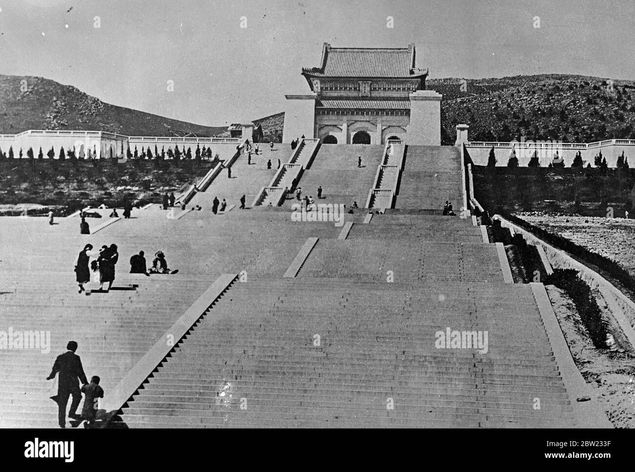 The Mausoleum on the slopes of Purple Mountain, Nanking. The monument is a revered spot to all Chinese. The population of Nanking, China's capital, is awaiting the carrying out of the threat of the Japanese commander-in-chief in Chinese waters, Vice Admiral Hasegawa, to destroy the city from the air. 54 Japanese planes have already carried out a dress rehearsal of the big raid threatened for today. There are 300 British residents in Nanking and the men are remaining at the posts. 21 September 1937 [Japanese troops who have reached the outskirts of Nanking, have planted their banner on the Purp Stock Photo