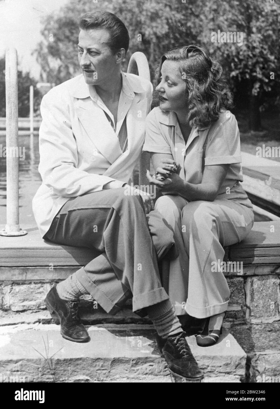 Tallulah Bankhead, the American actress retired to a honeymoon retreat in Norwalk, Connecticut with her bridegroom, Mr John Emery after their night wedding at Jasper, Alabama. The ceremony took place in the home of Miss Bankhead's father, Mr William Brockman Bankhead, speaker of the American house of representatives. 10 September 1937 Stock Photo