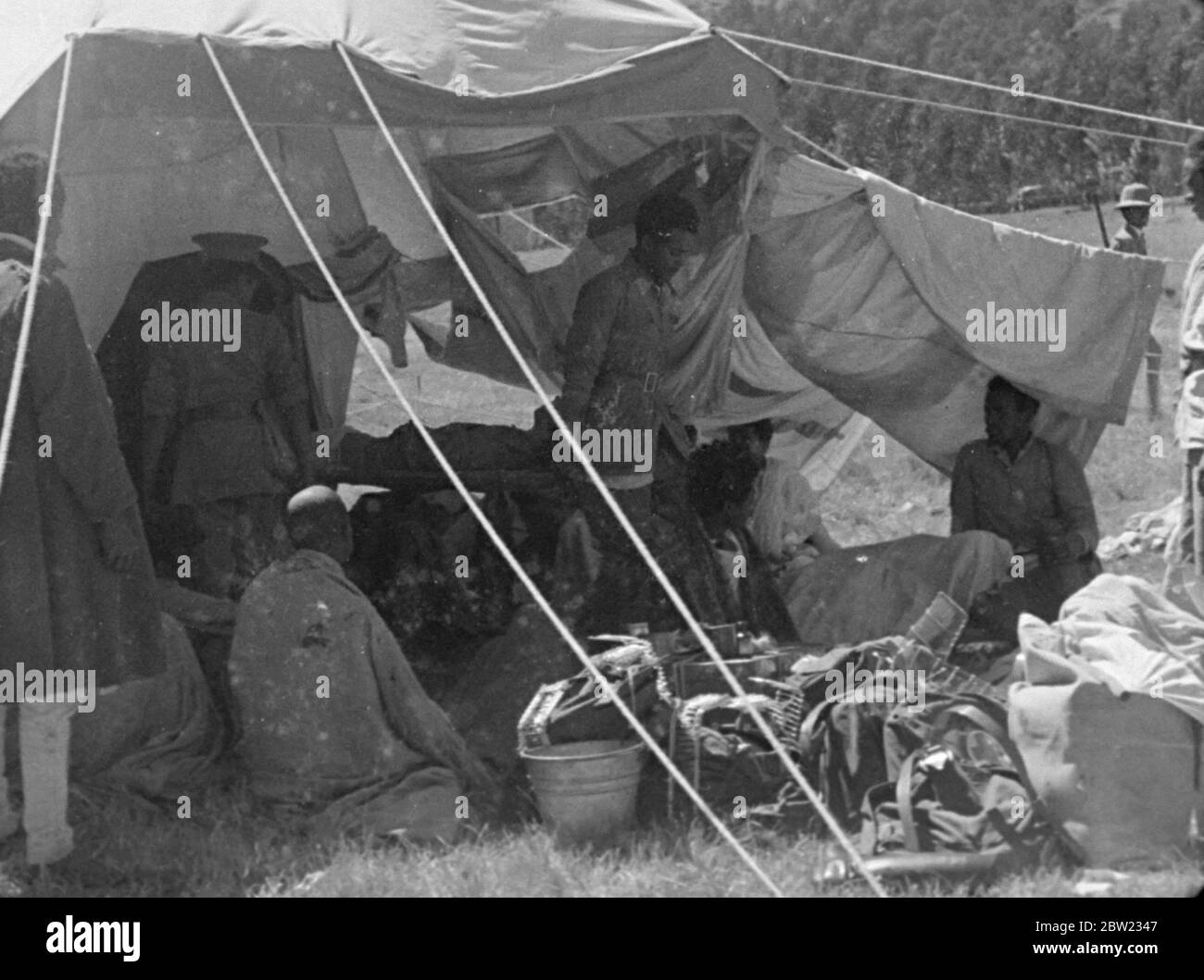 Italian Ethiopian war , 1935 -1936 The bombing of the Ethiopian village of Dessye by Italian planes. Casualties being brought into a medical tent for treatment . 9 December 1935 Stock Photo