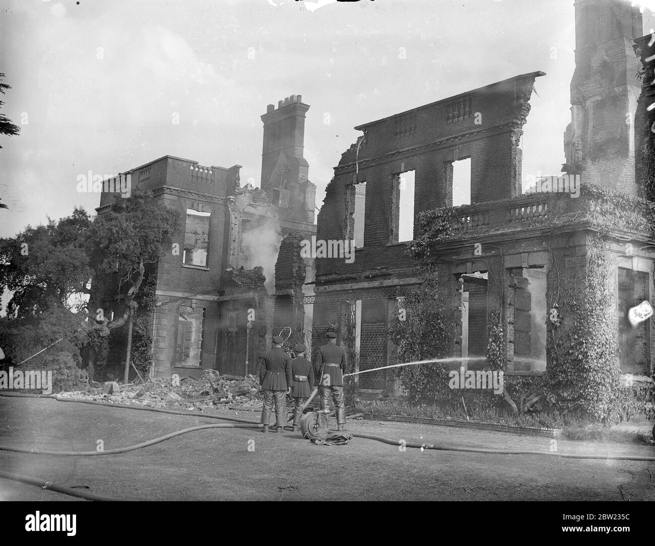250-year-old Bedfordshire mentioned destroyed by mystery fire. Police enquiries about motorist. A 250 year old unoccupied 60 room mansion, Ickwell Bury, near Biggleswade, Bedfordshire, was destroyed by fire, which lit up the whole countryside. Fireman from three towns for the flames are several hours. Following the fire, police are making enquiries concerning a motorcar which a girl from Ickwell villages, says she saw leaving the mansion just before the outbreak. The house, which is owned by Mr R T Les, of Farnham, had been used for the past 20 years as a preparatory school. It had a magnifice Stock Photo
