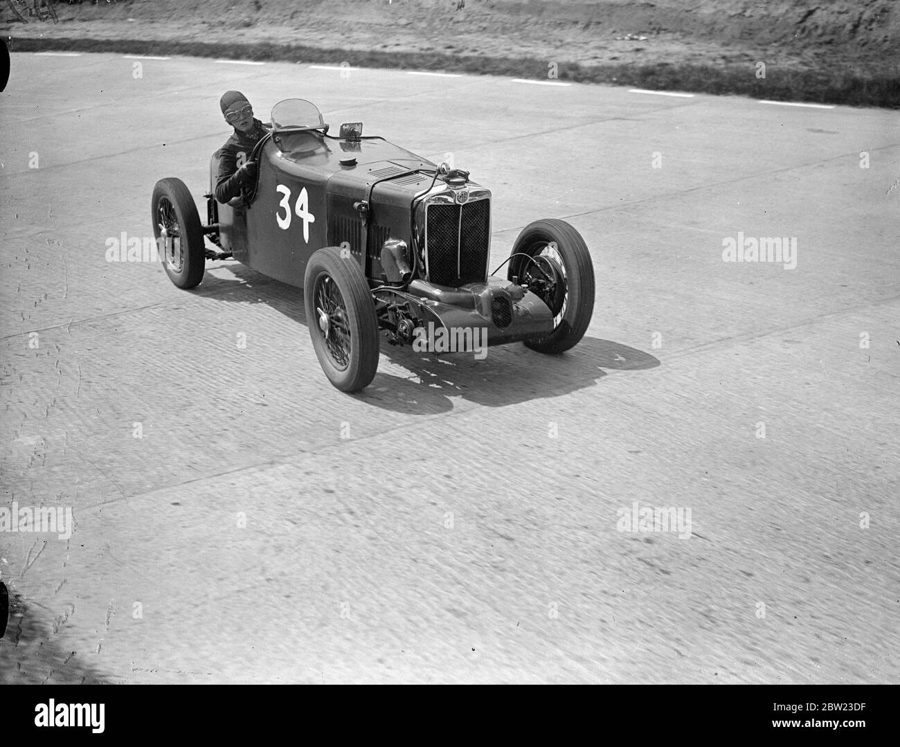 Miss D Stanley-Turner and her supercharged MG on the test hill hairpin during practice. It will be the first time that women take part in the events on the new road racing track , the Campbell Circuit , at Brooklands . 8 July 1937. Stock Photo