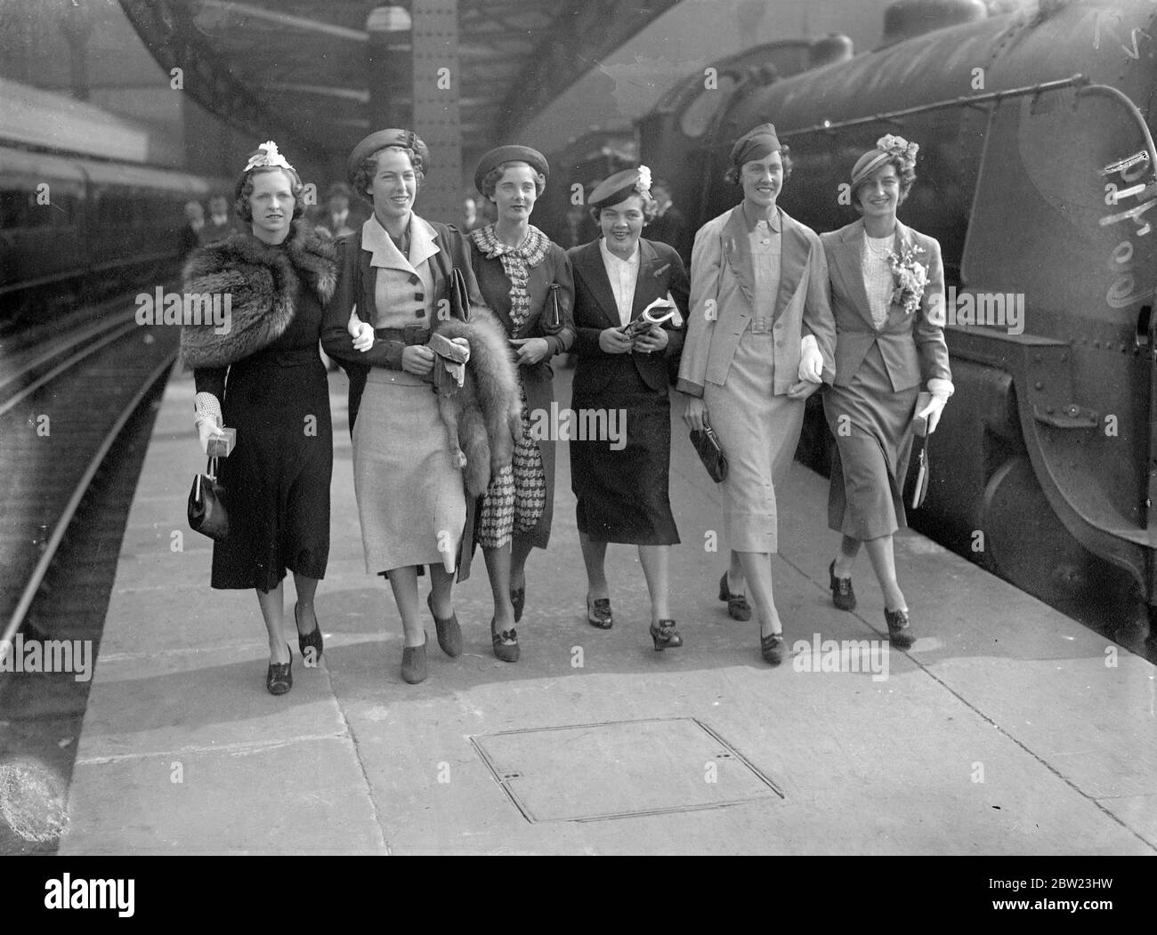 The British Whitman Cup tennis team left Waterloo Station on the  Queen Mary  boat train for America, where they are to meet the United States Team. The team , left-to-right: Miss F. James, Miss A. Lumb, Miss K. Stammers, Miss E. H. Dearman, Miss J. Ingram, and Miss R. M. Hardwick. 21 July 1937 Stock Photo