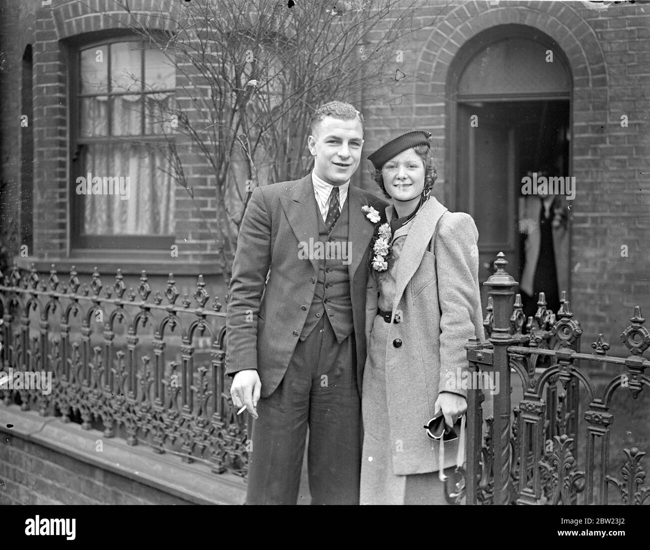 'Ten Goal' Payne married at Luton. Brides Lucky horseshoe. Joe (Ten Goal) Payne, famous Luton town football club forward, was married at Luton register office (Beds) to Miss Peggy Howe, aged 22, tester in a Luton factory. Afterwards, Payne played for Luton against Bradford. His bride watched the match. 26 February 1938 Stock Photo
