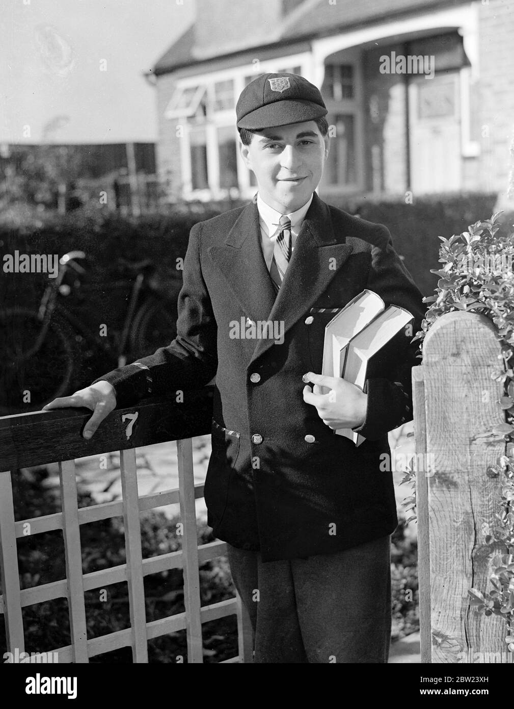 Although only 15, Jack Ralph Blanchfield, of Raynes Park, London, has matriculated with honours in all the subjects for which he sat for examination. John, only son of Mr Stanley Blanchfield, an architect, won the Merton foundation scholarship before he was 10. He is a pupil of the Rutlish Secondary School at Merton. Here's keenly interested in chemistry. Photo shows Jack Blanchfield making a chemical experiment outside his laboratory in the garden of his home. 17 October 1938 Stock Photo
