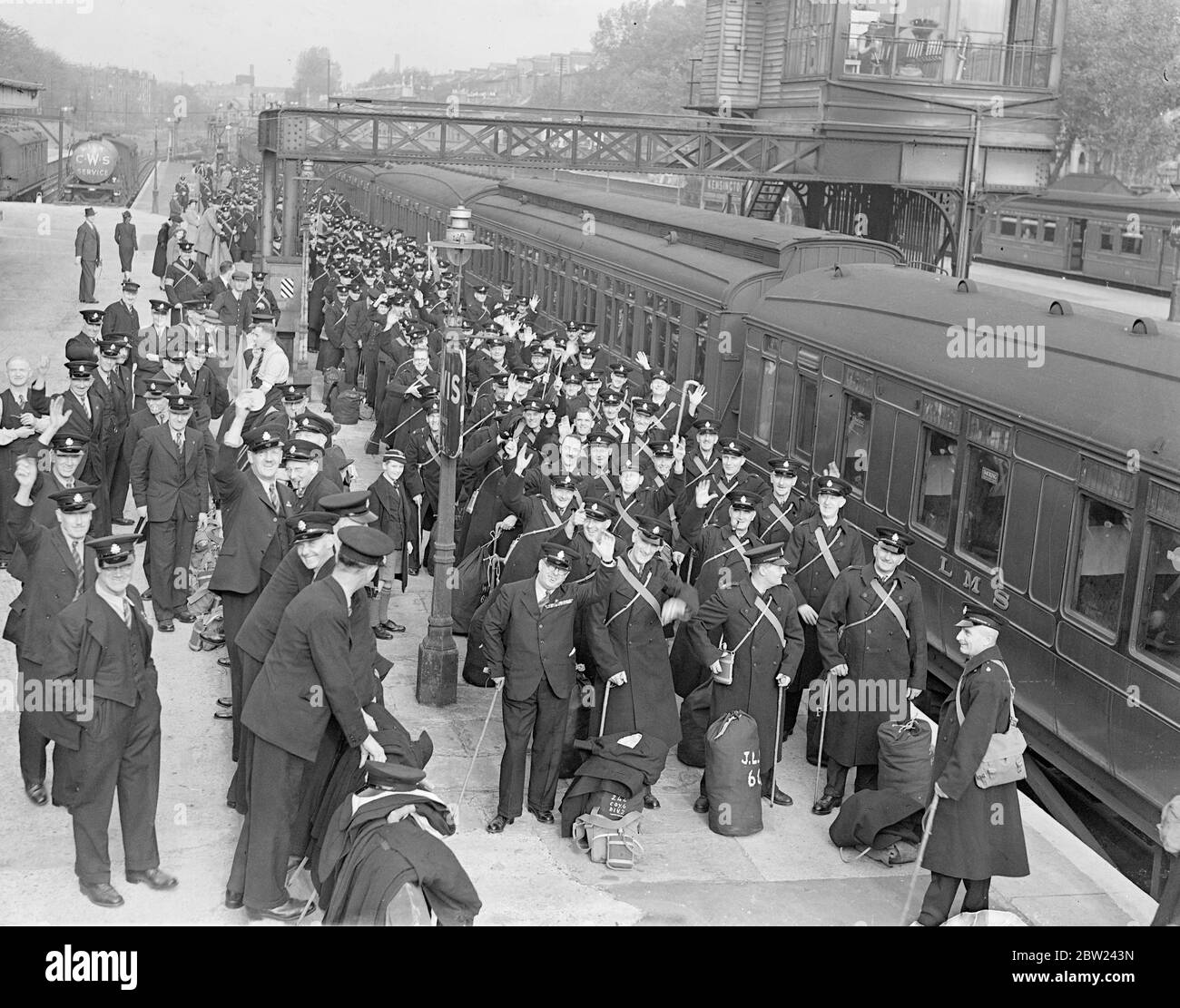 The 1200 members of the British Legion who are to police the Czechoslovak plebiscite area are now encamped at Olympia, London, where they are preparing to leave for Czechoslovakia on Saturday. Photo shows: The British Legion police arriving at Addison Road station. 12 October 1938 Stock Photo