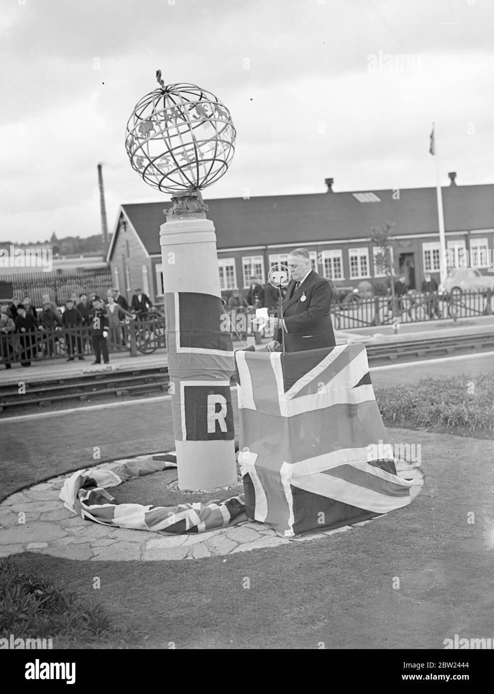 A commemorative column was unveiled at the present-day Southampton docks, one of the largest systems in the world. Mr R Holland Martin, chairman of the Southern Railway company, owner of the docks unveiled the column. Photo shows: A view of the ceremony as Mr R Holland Martin made his speech at the unveiling. 12 October 1938 Stock Photo