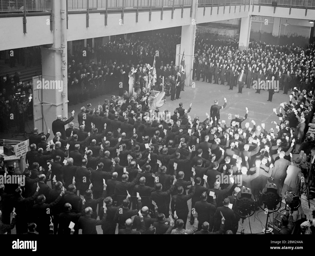 The 1200 members of the British Legion who are to police the Czechoslovak plebiscite area are now encamped at Olympia, London, where they are preparing to leave for Czechoslovakia on Saturday. Photo shows: the British Legion police taking the oath at Olympia. 7 October 1938 Stock Photo