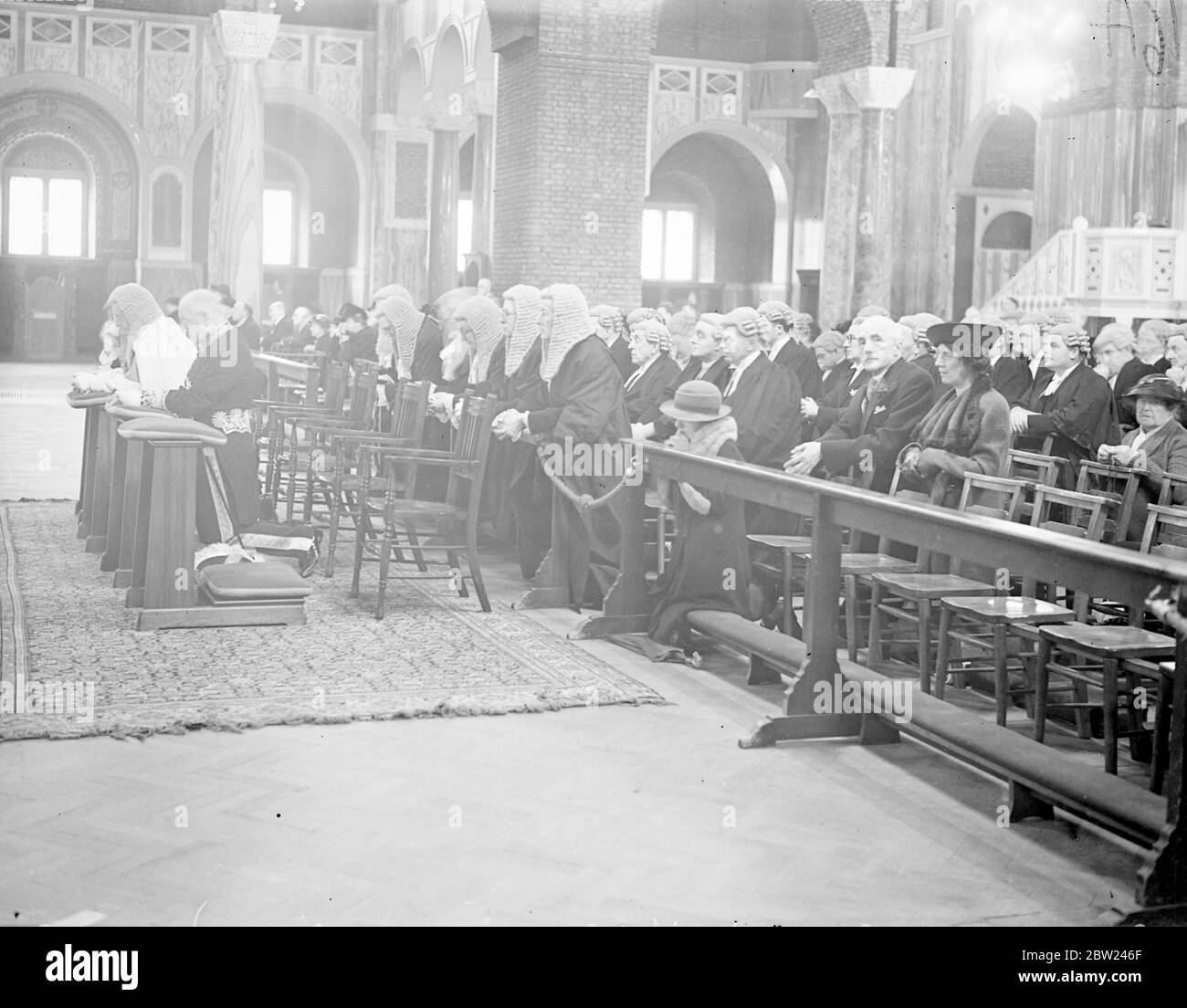 Roman Catholic Judges attended the customary Red Mass in Westminster Cathedral on the occasion of the reopening of the Law Courts after the Long Vacation. Photo shows: Judges kneeling at the Mass in Westminster Cathedral. 12 October 1938 Stock Photo