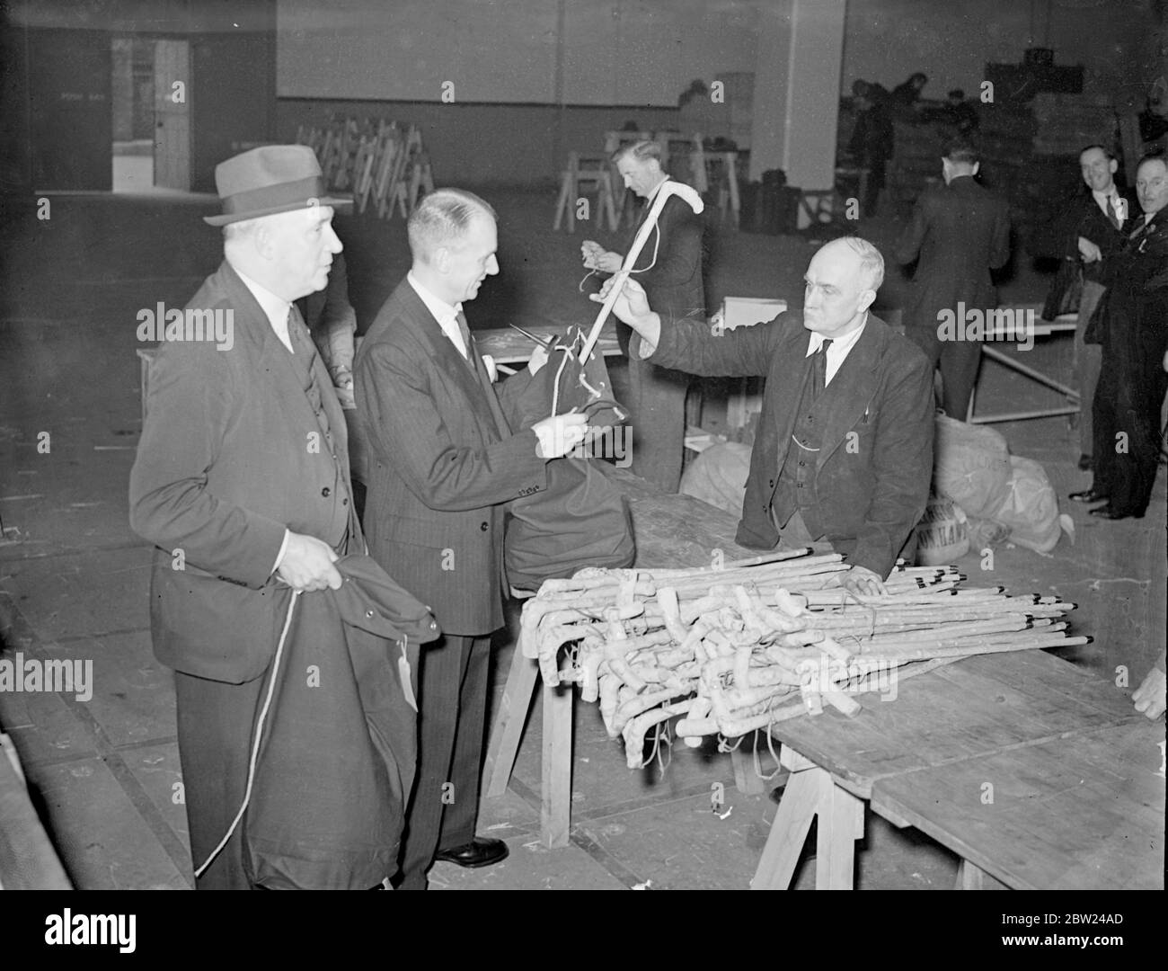 The 1200 members of the British Legion who are to police the Czechoslovak plebiscite areas are now encamped at Olympia, London, where they are preparing to leave for Czechoslovakia on Saturday. Photo shows: Members of the force being measured for uniforms at Olympia. 6 October 1938 Stock Photo