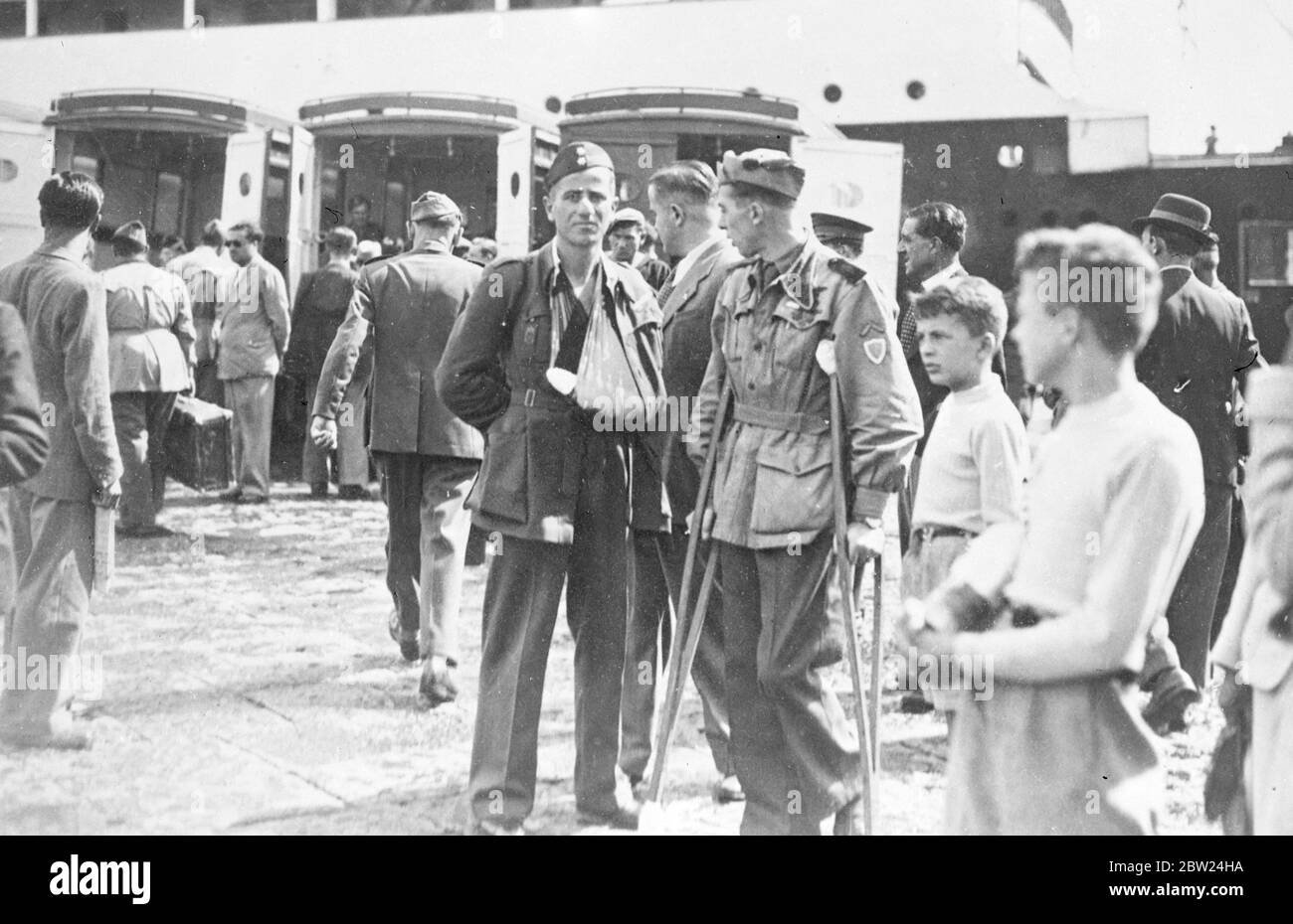 Italian casualties arrive home from Spain. Italian legionaries injured fighting for General Franco in Spain, arrived at Naples on the S S Gradisca. They were given an elaborate reception by fascist party officials and the population. 3 September 1938 Stock Photo