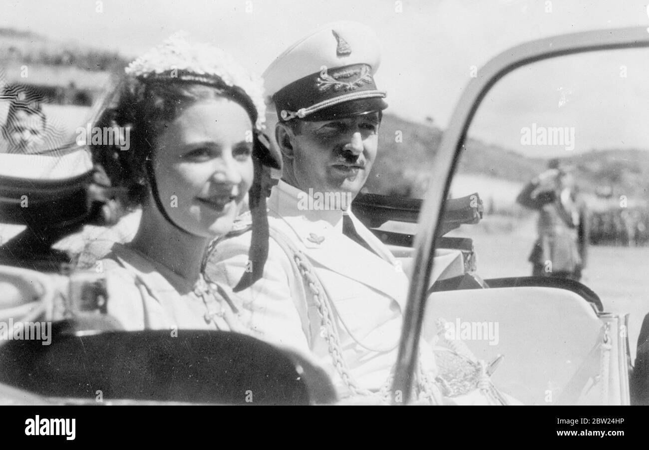 King Zog and his Queen at celebrations in Durazzo. King Zog of Albania and  is smiling young Queen Geraldine, driving away after attending a military  parade at the Albanian port of Durazzo
