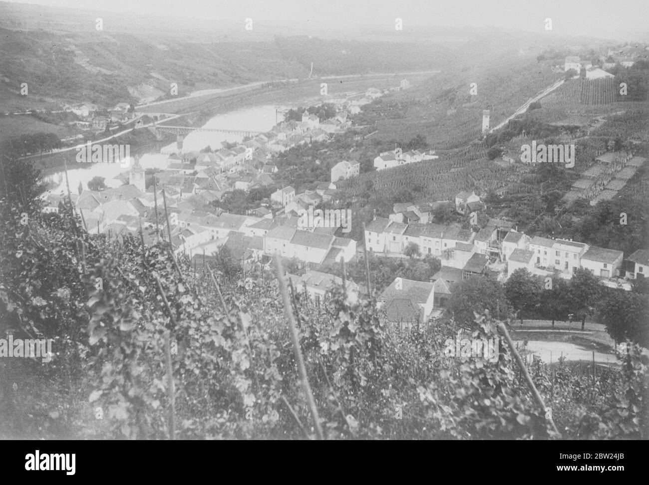 It is reported that Germany has invaded Holland, Belgium and Luxembourg. Photo shows: a view of the little town of Wormeldange, showing the river Moselle in the background. Germany is the far side of the river. A strategic road of the most importance to the German runs through this town and district. It was constructive by the Germans. 10 May 1940 Stock Photo