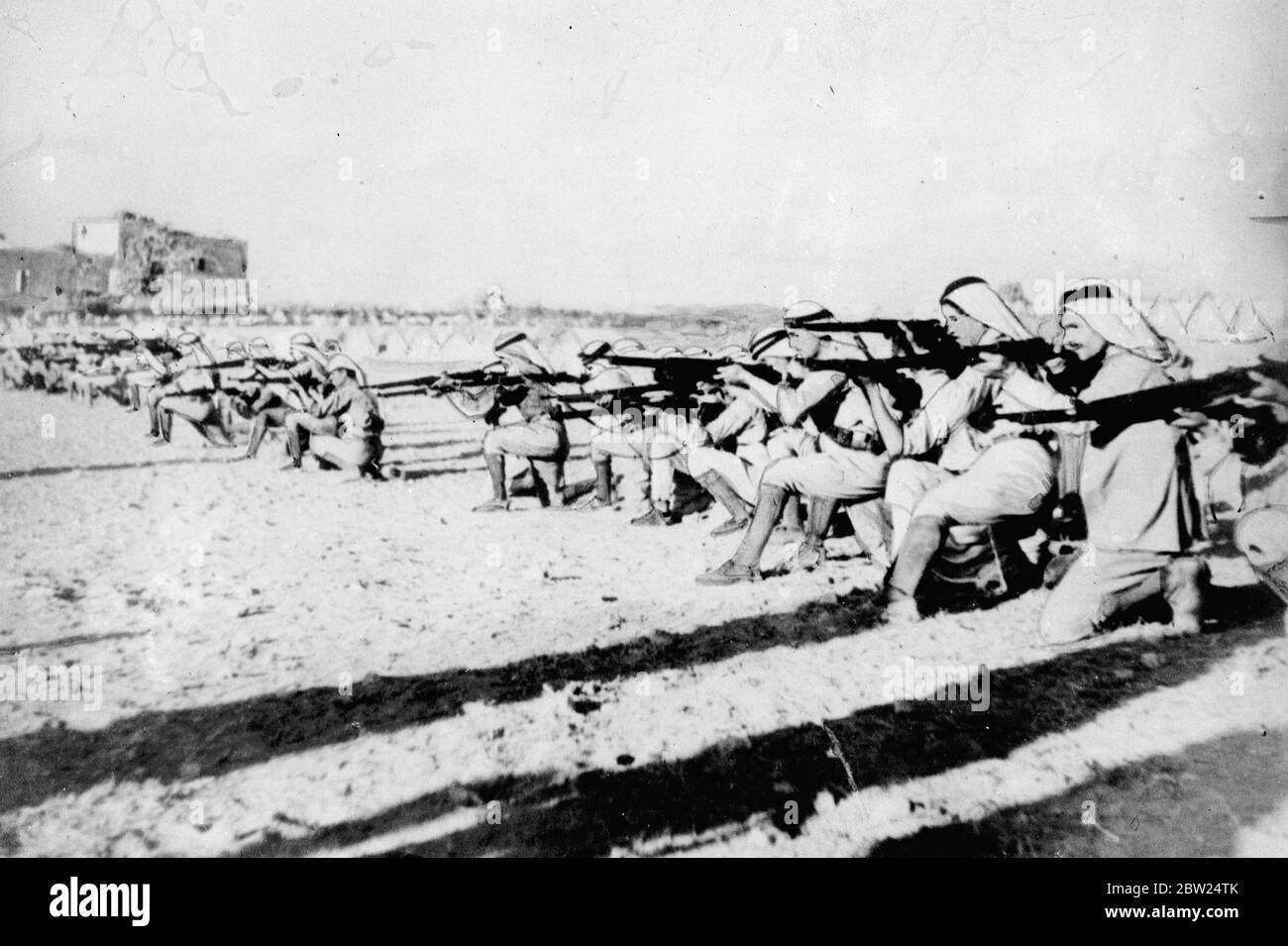 First pictures ever taken of Arab rebel army. Received in London as battles break out again in Palestine. These are the first authentic pictures ever taken of the Arab rebels in the Holy Land, where they have defied the British authorities in constant warlike acts. The pictures, received in London as British troops backed by bombers are once more attempting to quell a serious outbreak among the Arabs, were taken at the headquarters of Abdul Razek. The rebel leader is widely known in the Palestine for his intense hatred of the British and his fearless campaign against her authority. The picture Stock Photo