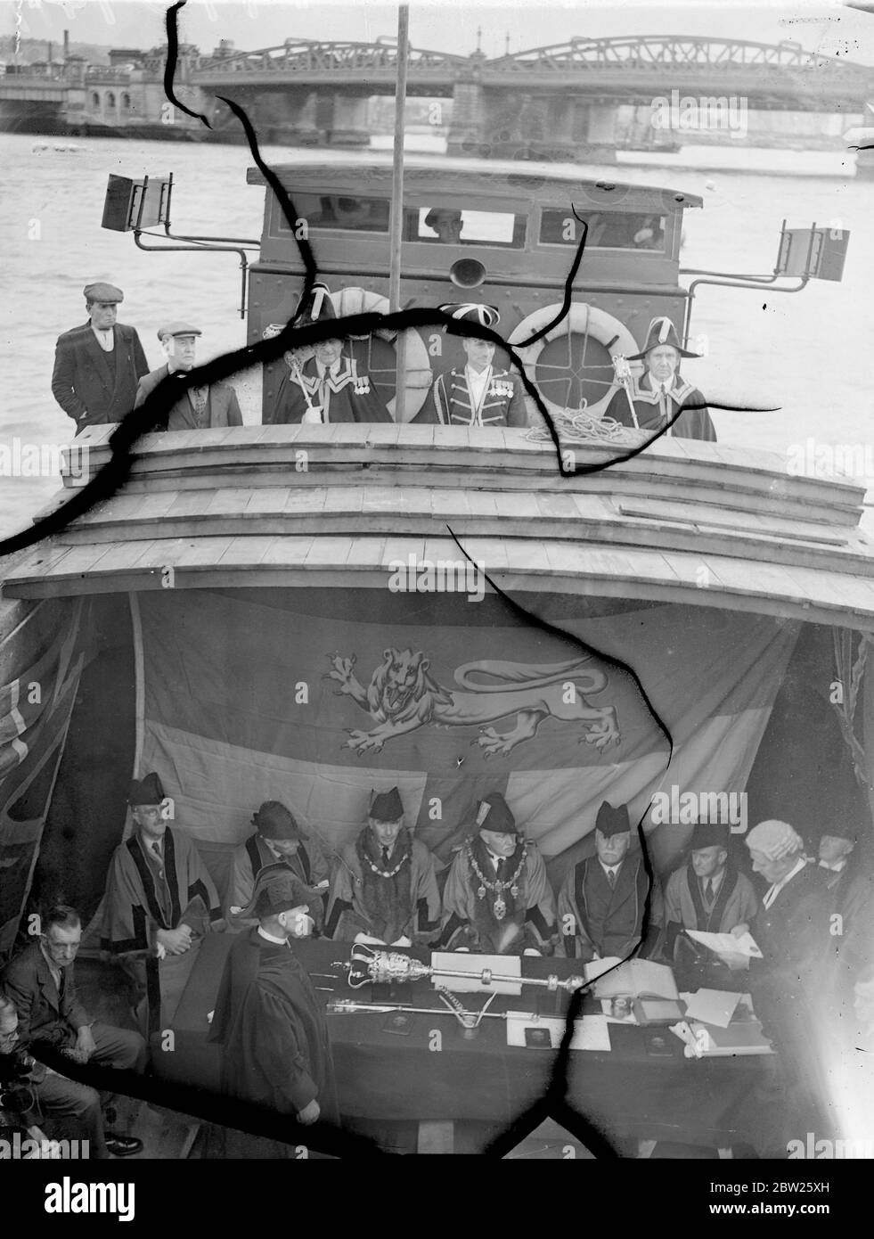 Admiral of the Medway's Court in a barge. Mayor in centuries old office. The Admiral of the Medway's Court, which controls twenty miles of the river fisheries, had its annual meeting in the hull of a barge moored off Rochester to hear disputes or applications brought by Free Fishers of the Medway Councillor E C Edmunds, Mayor of Rochester, presided over the Court as Admiral of the Medway, a position held for centuriesby Mayors of the Kent town. twelve Free Fishers form the jury. Photo shows, the Admiral's court in the barge moored on the Medway. 9 July 1938 Stock Photo