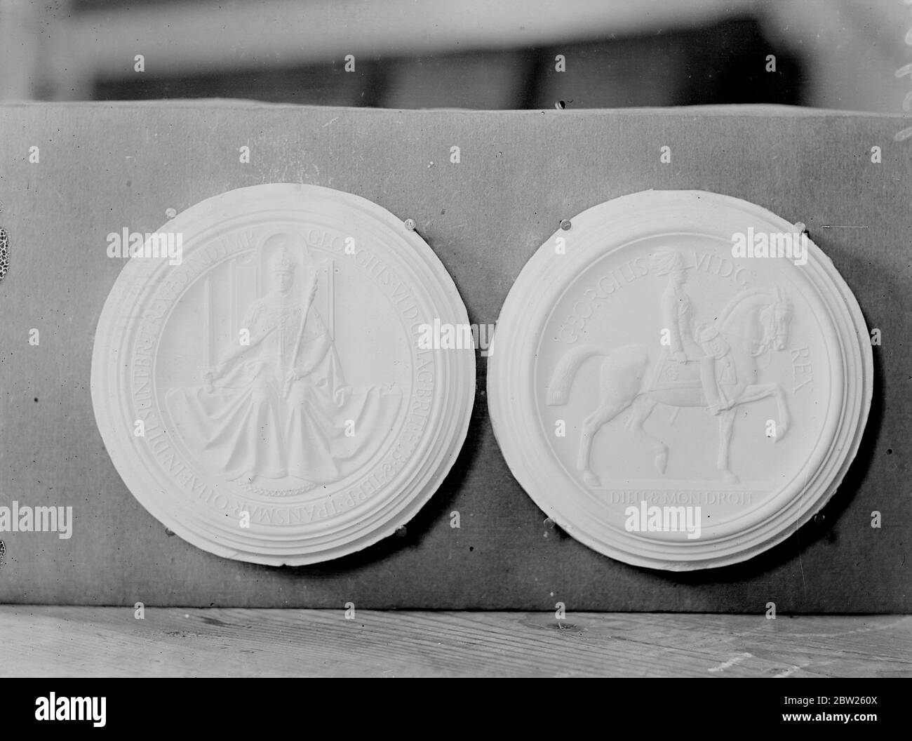 New impression for the Great Seal at Royal Mint. The new impression for the Great Seal of England was on view at the Royal Mint, London. Photo shows, the plaster impression of the Great Seal at the Royal Mint. The front is on left and the back is on right 26 February 26 1938 Stock Photo