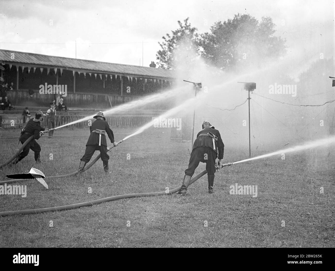 marksmen in Firemen's competition at Guilford. The finest fire fighters in the country representative of 1,000 brigades took part in the Ntional Fire Brigades Association competitions at Guilford, Surrey. Photo shows, hitting the targets in the Junior Motor Pump Competition. 4 July 1938 Stock Photo