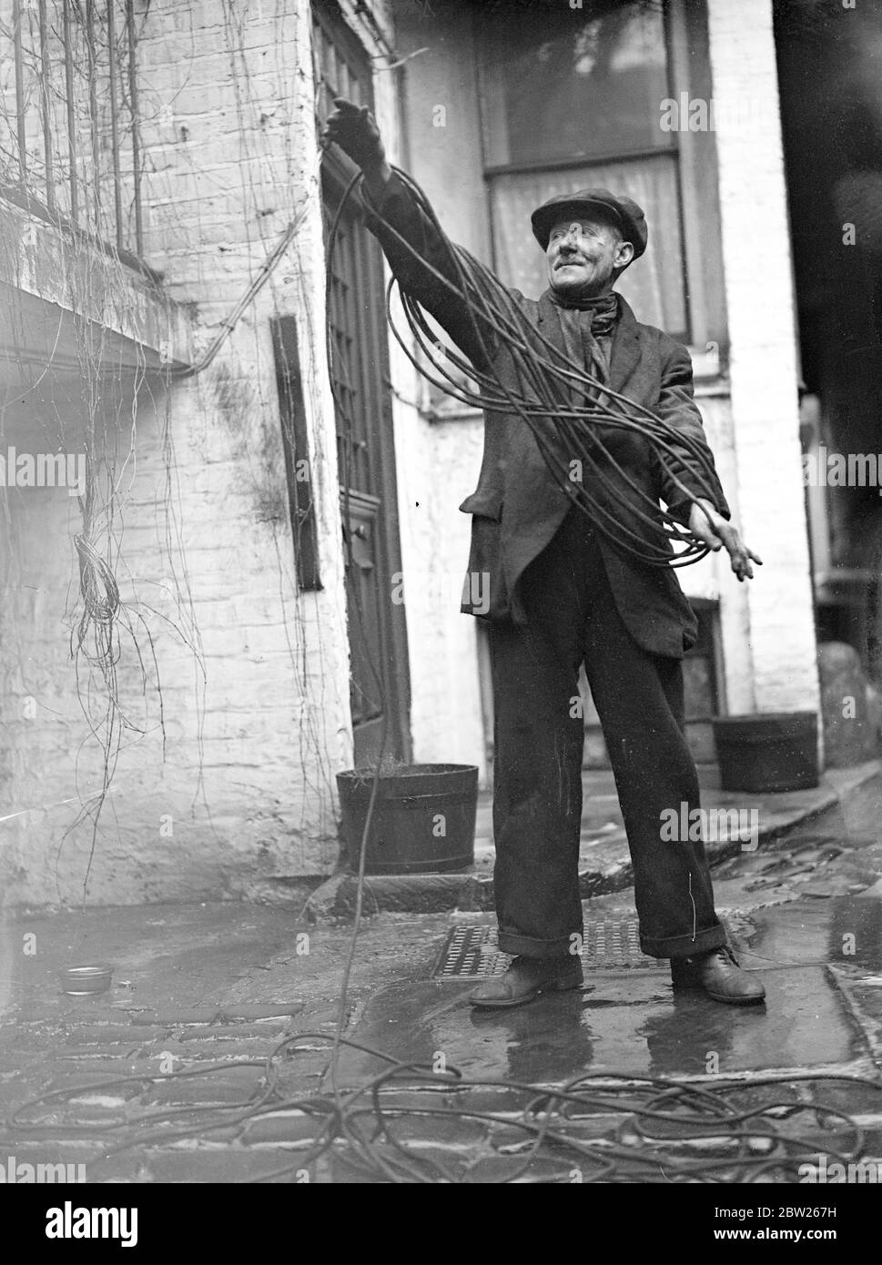 A Day in the life of a chimney sweep. A chimney sweep tidies his lines. Stock Photo