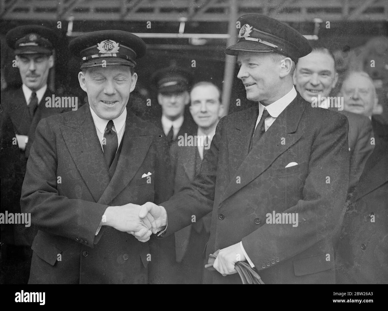 New London Fire Brigade chief taken over. Commander A N G Firebrace, the new Chief of the London Fire Brigade, Major C C B Morris, at the Fire Brigade headquarters on the Albert embankment. Photo shows, the new chief, Commander A N G Firebrace (right) being greeted by Major C C B Morris, the retiring chief. 3 May 1938 Stock Photo