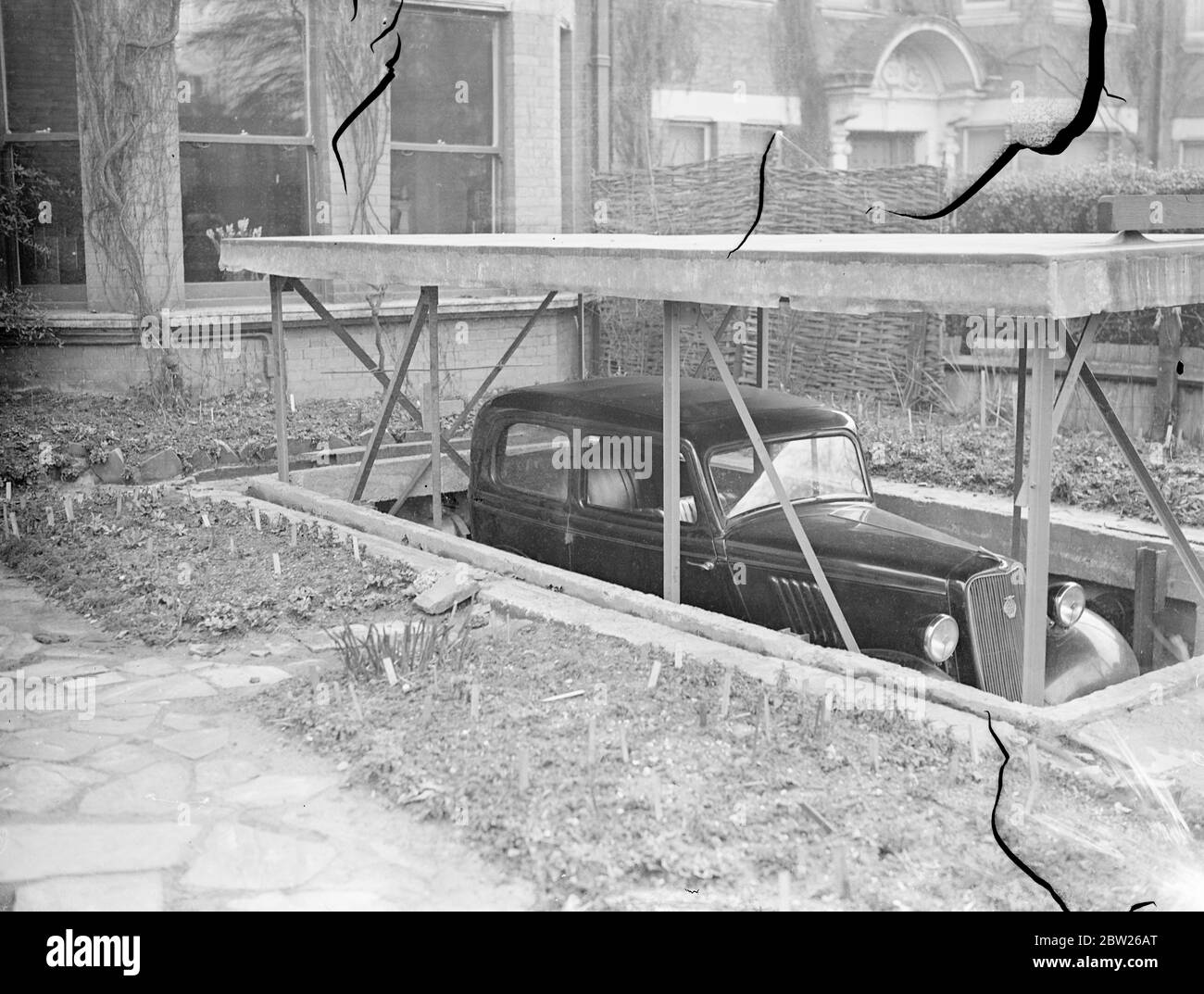 'Pushbutton' garage beneath the front garden. London man solves car
