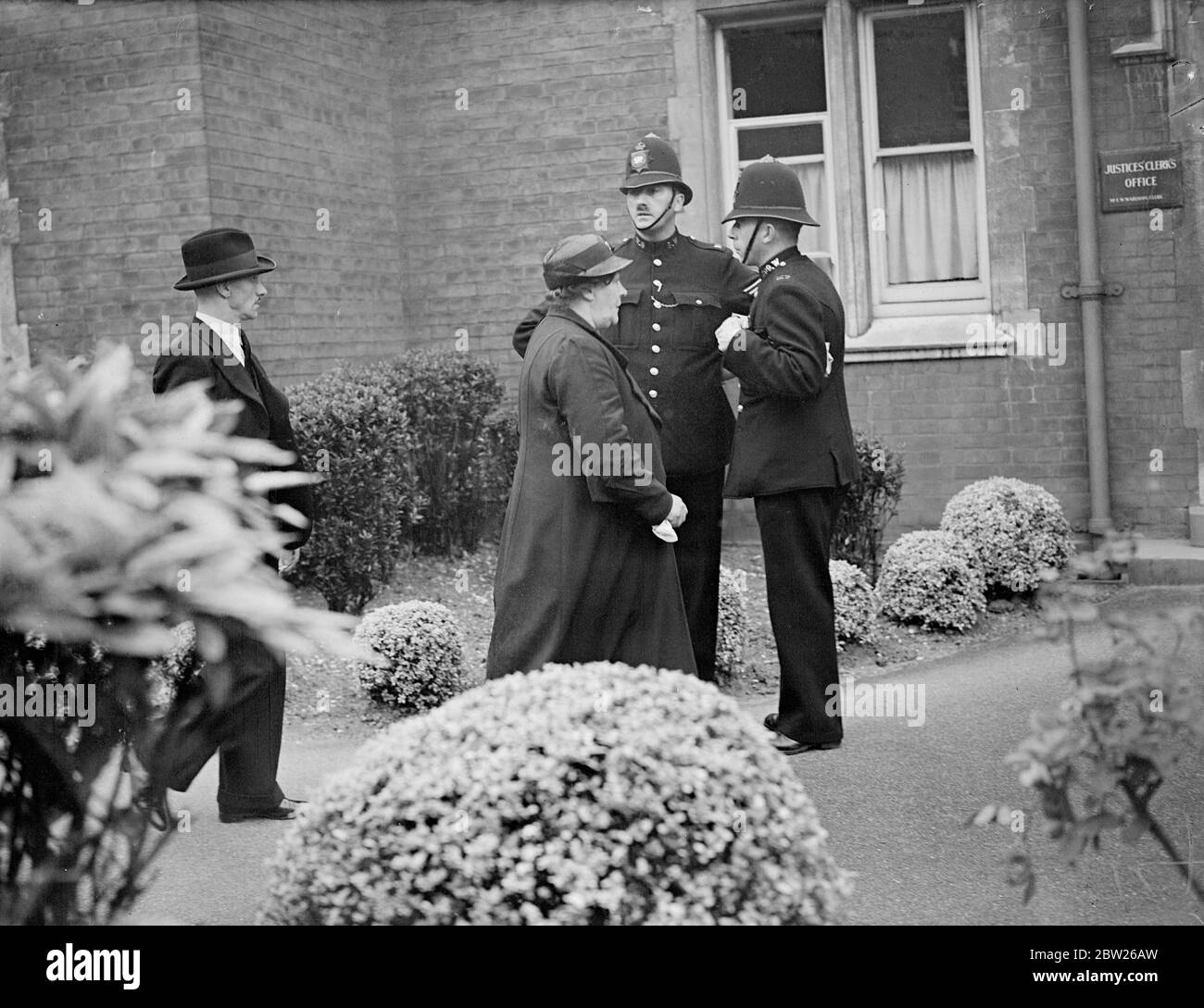 Brain appears on remand at Wimbledon dead woman's husband at court.. George Brain appeared on remand at Wimbledon. Police Court charged with the murder of Mrs Rose Muriel Atkins, whose body was found beside a Wimbledon Road. Photo shows, the husband George Robert Atkins of the dead woman arriving at the court with his mother. 2 August 1938 Stock Photo