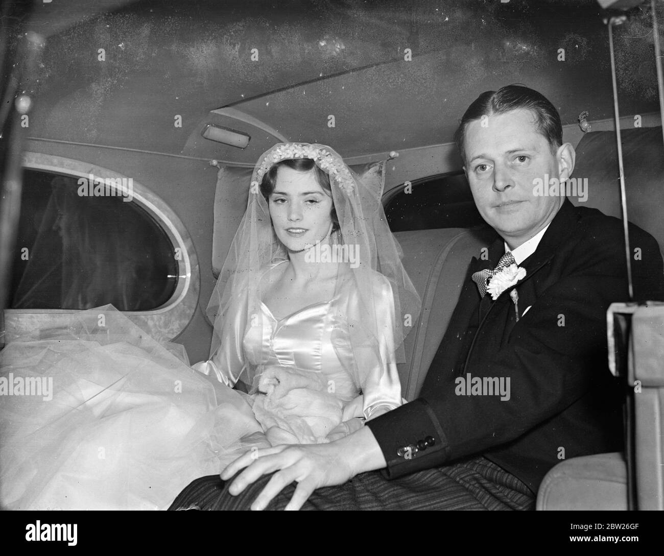 Lady Patricia Douglas Leas with father for wedding to Count John de Bendern. Lady Patricia Douglas, daughter of Lady Dunn and the Marquess of Queensberry, was married at Brompton Oratory to Count John de Bendern, son of Count and Countess de Bendern and British amateur golf title in 1932. Count John was then called John de Forest, but changes his name by deed poll on his father becoming Count von Bendern of Lichtenstein. Photo shows, Lady Patricia Douglas and her father, the Marquess of Queensberry, driving from the home of the brides mother, Norwich House, Norfolk Street, to the wedding. 27 J Stock Photo