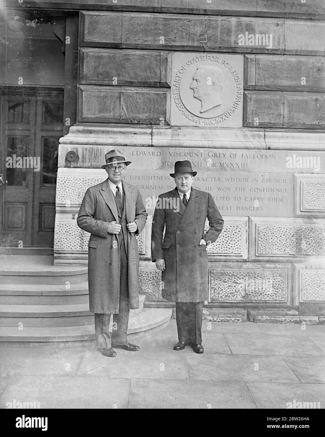 New American Ambassador at the foreign office. Soon after his arrival in London to take up his appointment, Mr Joseph P Kennedy, the new American Ambassador, went to the Foreign Office to see Lord Halifax, the Foreign Minister. Photo shows, Mr Joseph Kennedy (glasses) , leaving the Foreign Office, after his visit, will Mr Herschel V Johnson , Counsellor at the American Embassy, who acted as charge d'affaires , while the Ambassadors post was vacant. 2 March 1938 Stock Photo