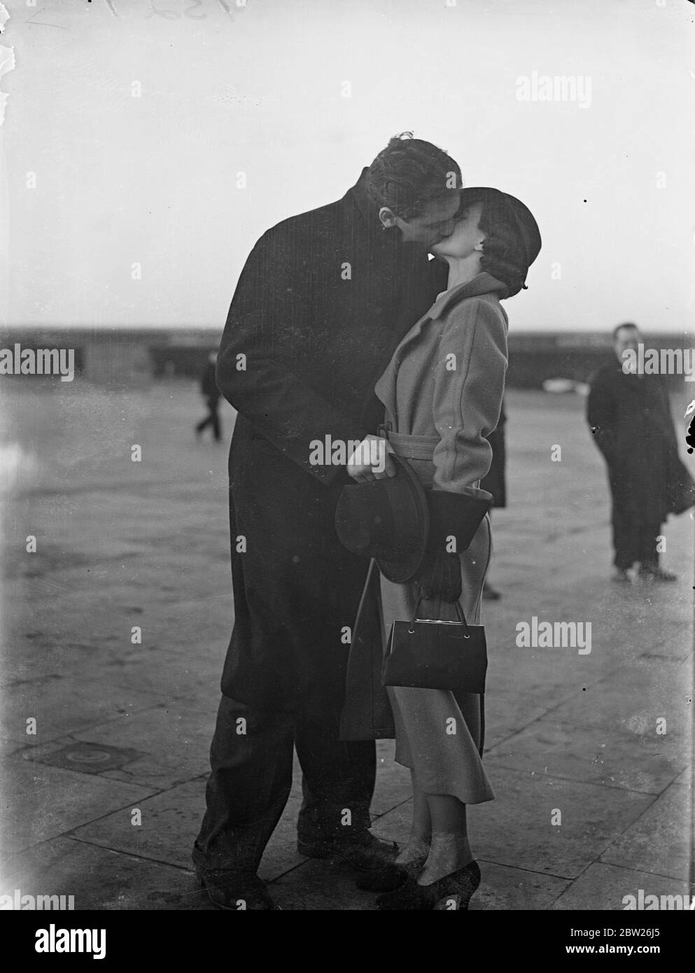 Ben Foord arrives home by air from Hamburg, welcomed by his wife. Ben Foord, the former British Empire heavyweight champion, who stood 12 rounds against Max Schmeling in Hamburg, arrived at Croydon by air from Hamburg art are suddenly changing his plans. He was greeted by his wife, at the aerodrome.. 1 February 1938 Stock Photo