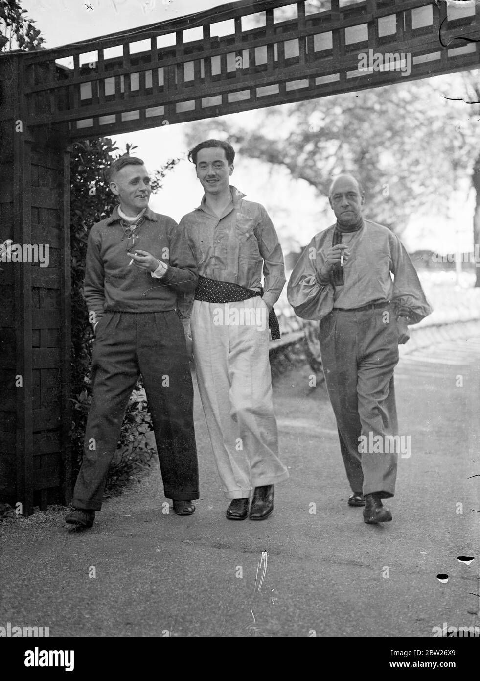 Men's dress Reform Party have reception in Regent's Park. Clad in 'reformed' masculine costume guests attended a reception of the Men's Dress Reform at the Open Air Theatre in Regent's Park, London. Photo shows, three of the guests wearing reformed dress, arriving for the reception. 29 June 1938 Stock Photo