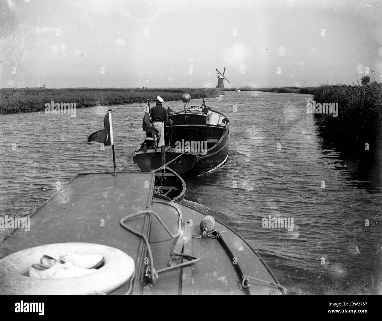 Sailing through The Broads. The vessel being towed. 1933 Stock Photo