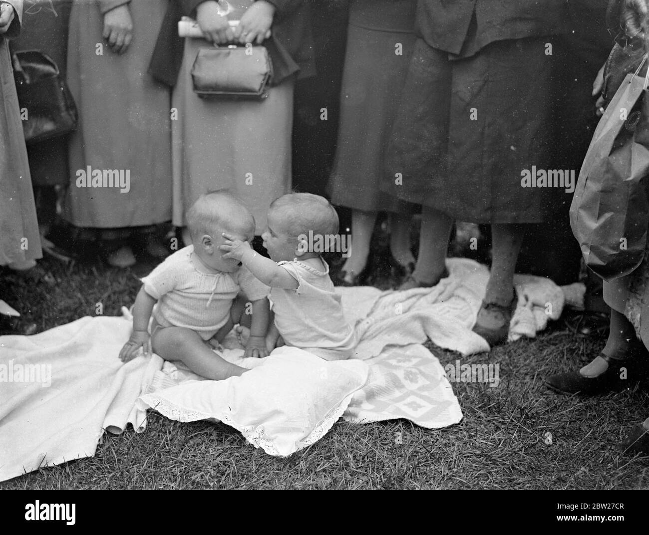 Babies in a 'spot of bother'. Hostilities open. Kenneth Cherry (right). unfortunately, garages, his friends eye. Sydney Dimond objected and the Dartford Carnival baby show echoed to his wails. 24 June 1937 Stock Photo