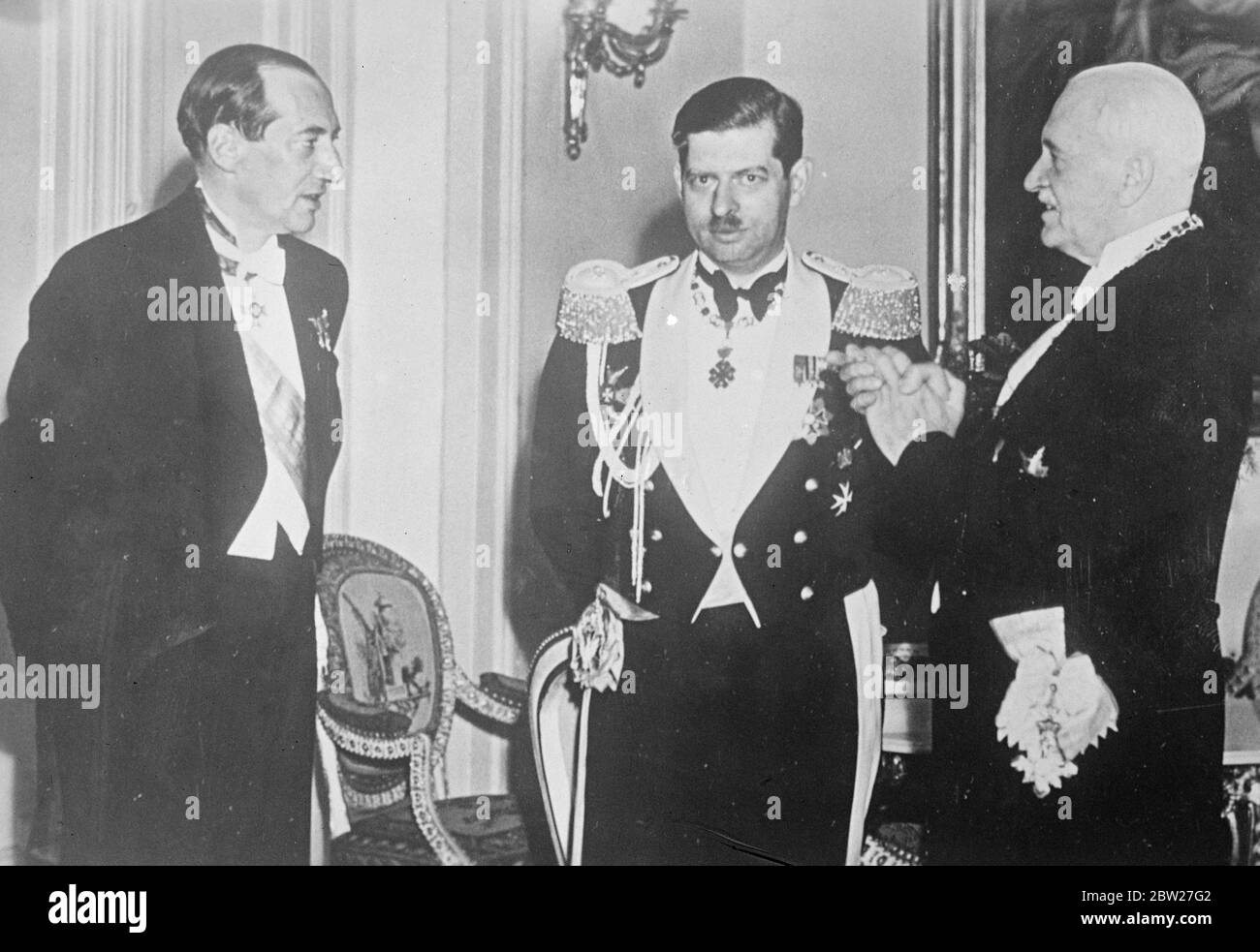 King Carol of Romania (center), who with Crown Prince Michael is visiting Warsaw, had a meeting with President Moscicki of Polland (right) and Colonel Beck, Polish Foreign Minister. 30 June 1937 Stock Photo