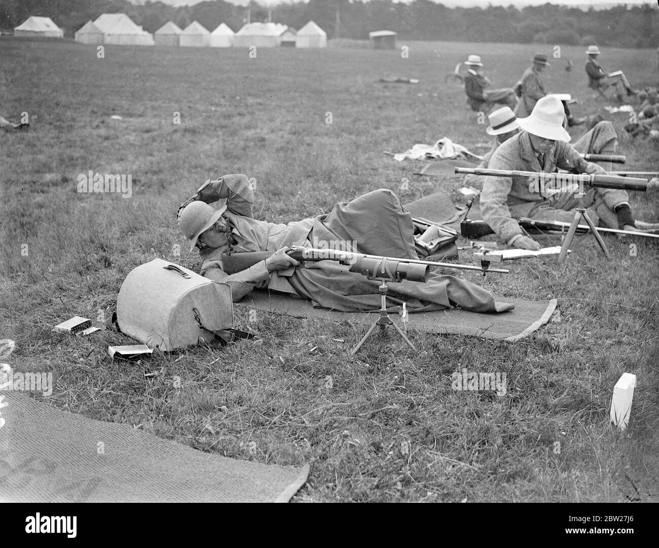 Resembling contortionists rather than marksmen, competitors took part in the shoot for the Ranking Cup on the Stickledown Ranges at the annual Bisley meeting. Miss Helen Rottenburgh in a curious position as she made herself comfortable during shooting for the Ranking Cup at Bisley. 2 July 1937 Stock Photo