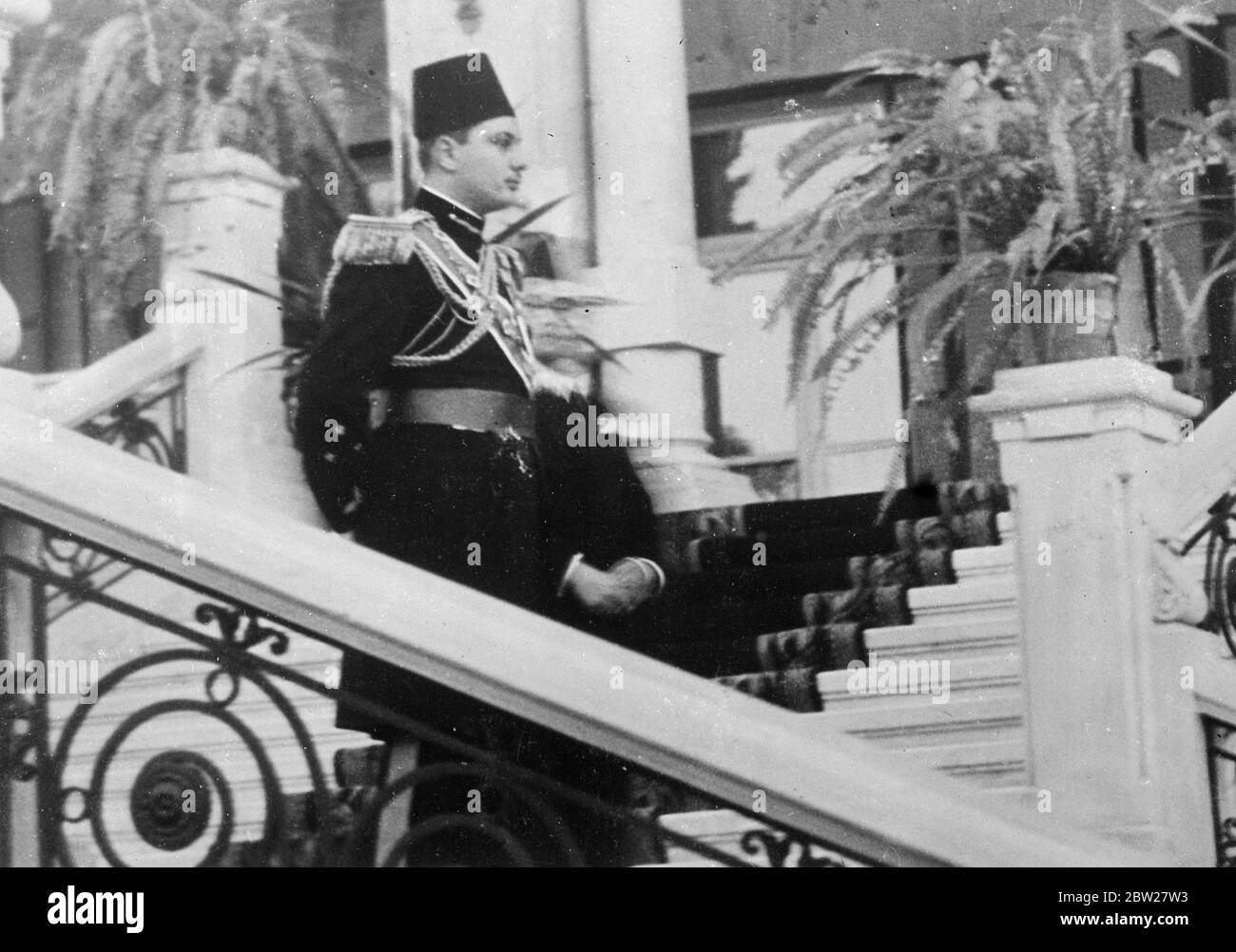 The wedding of King Farouk in Cairo. With traditional Muslim ceremony, 17-year-old King Farouk of Egypt, was married at the Koubbeh Palace in Cairo, to Miss Farida Zulficar Pasha, the judge of the Egyptian court of appeal. Photo shows, King Farouk as he waited anxiously to greet his bride at the Koubbeh Palace after the ceremony. After the marriage, at which she was not present, the bride returned home, going back to the Palace to join her bridegroom, some hours afterwards. 23 January 1938. Stock Photo