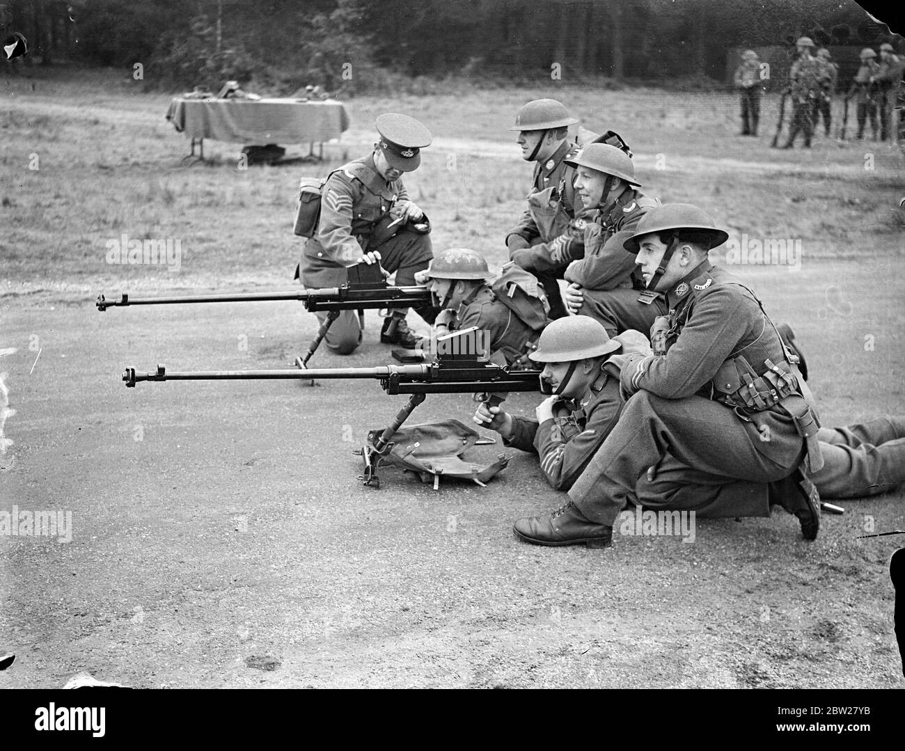 New anti-tank rifle at Aldershot demonstration. Latest equipment and training of the infantry detachments of the British Army were demonstrated by the 1st Battlalion the South Staffordshire Regiment in a series of exercises at Aldershot camp, Hampshire. Photo shows, the 'Boys Anti-Tank Rifle' being demonstrated. The rifle is .55 and the magazine holds five rounds. 21 January 1938 Stock Photo