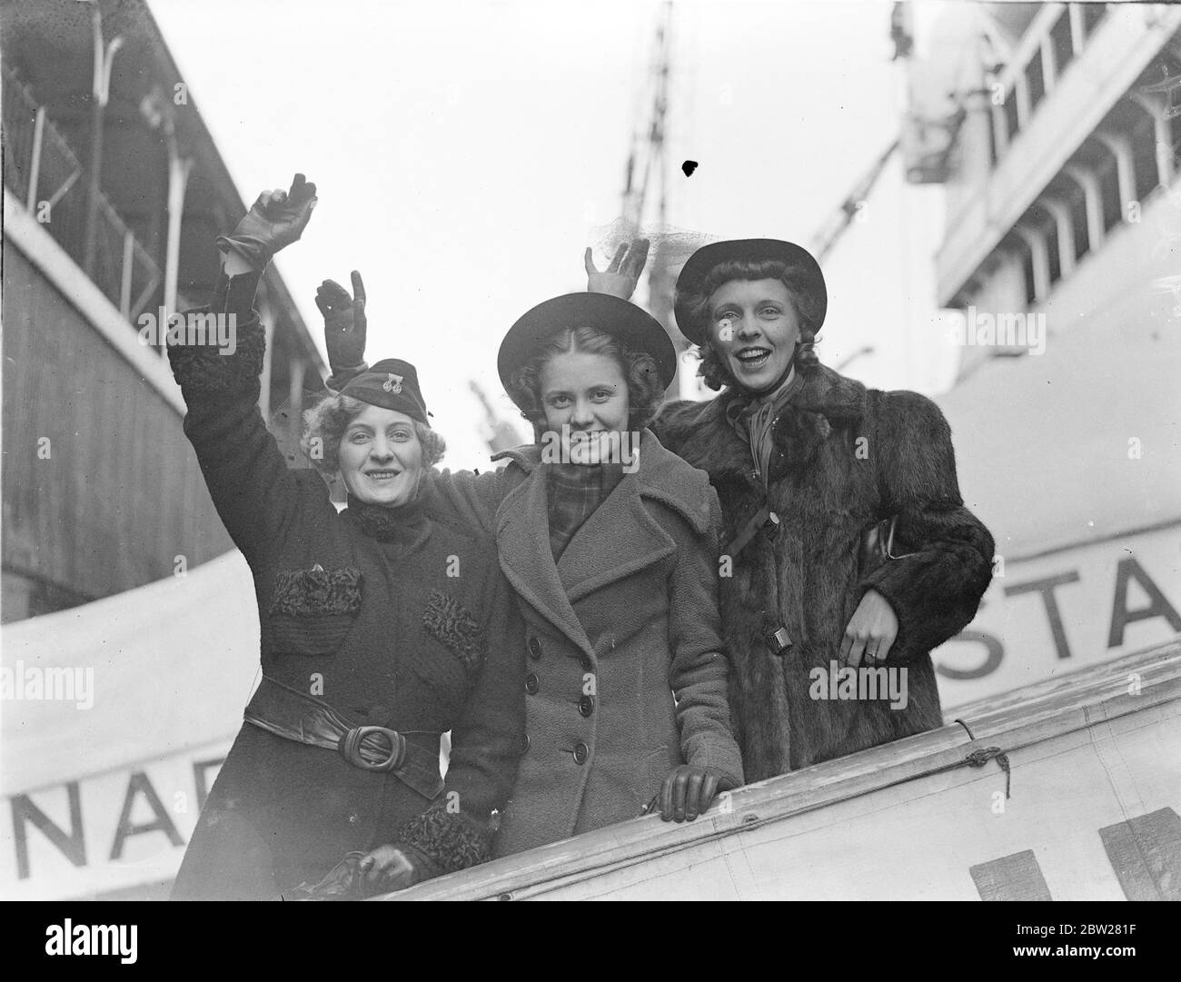US table tennis team arrived for world Championships. The United States table tennis team which is to compete in the forthcoming world Championships in London, arrived at Southampton on the liner 'Aquitania'. Photo shows, the three girl members of the party, Clara Harrison, Betty Henry and Mildred Wilkinson. 19 January 1938 Stock Photo