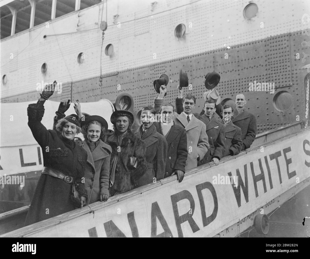US table tennis team arrived for world Championships. The United States table tennis team which is to compete in the forthcoming world Championships in London, arrived at Southampton on the liner 'Aquitania'. Photo shows, the American team on arrival at Southampton, left to right, Clara Harrison, Betty Henry, Mildred Wilkinson, George Hendry, Sol Schiff, Burnard Grimes, Jimmy McClure, Louis Pagliare, and Moris B Bassford. 19 January 1938 Stock Photo