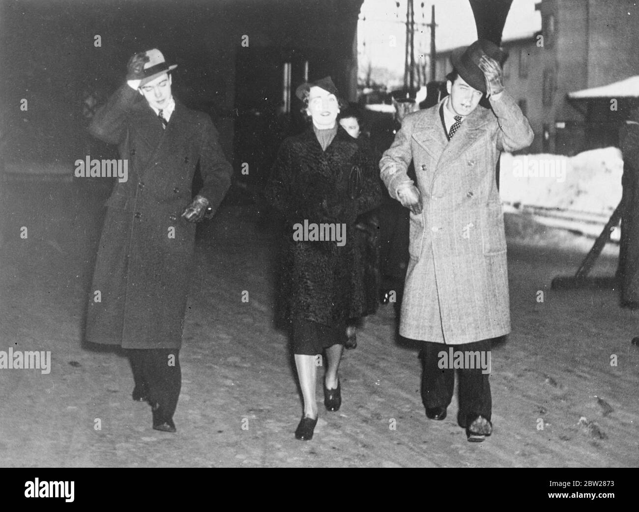 Crown Princess Ingrid welcomed by her brothers, visiting her father in Stockholm. Crown Princess Ingrid of Denmark, wife of Crown Prince Frederik, has arrived in Stockholm to visit her father, Crown Prince Gustaf Adolf of Sweden. Photo shows, Crown Princess Ingrid with her two brothers, who greeted her on arrival in Stockholm. Prince Carl Johan is on left and Prince Bertil on right. 8 January 1938 Stock Photo